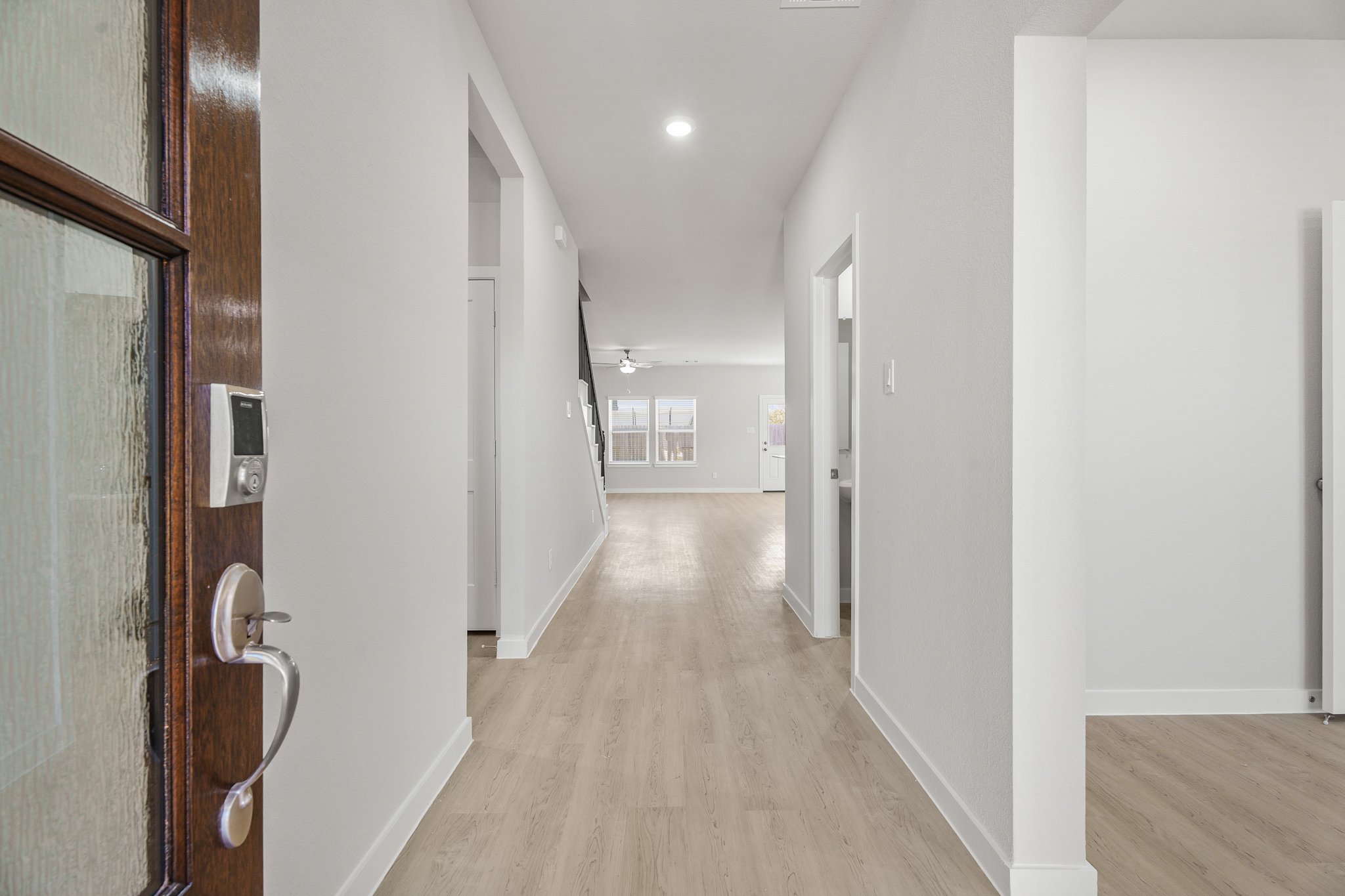 A hallway with white walls.