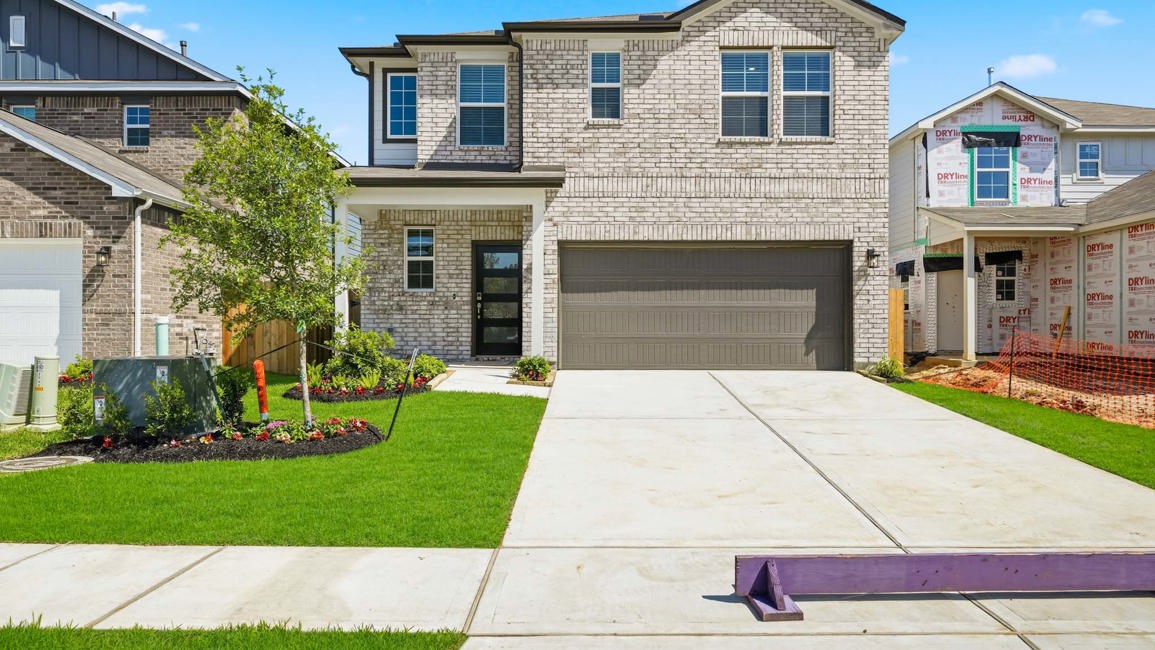 A large house with a driveway.