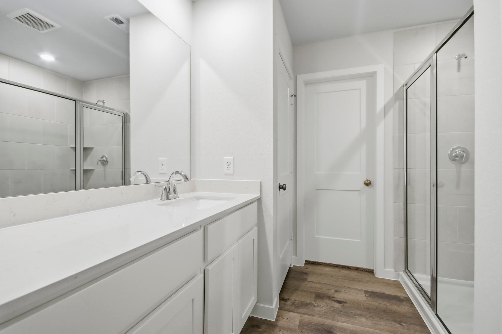 A bathroom with a tub and shower.