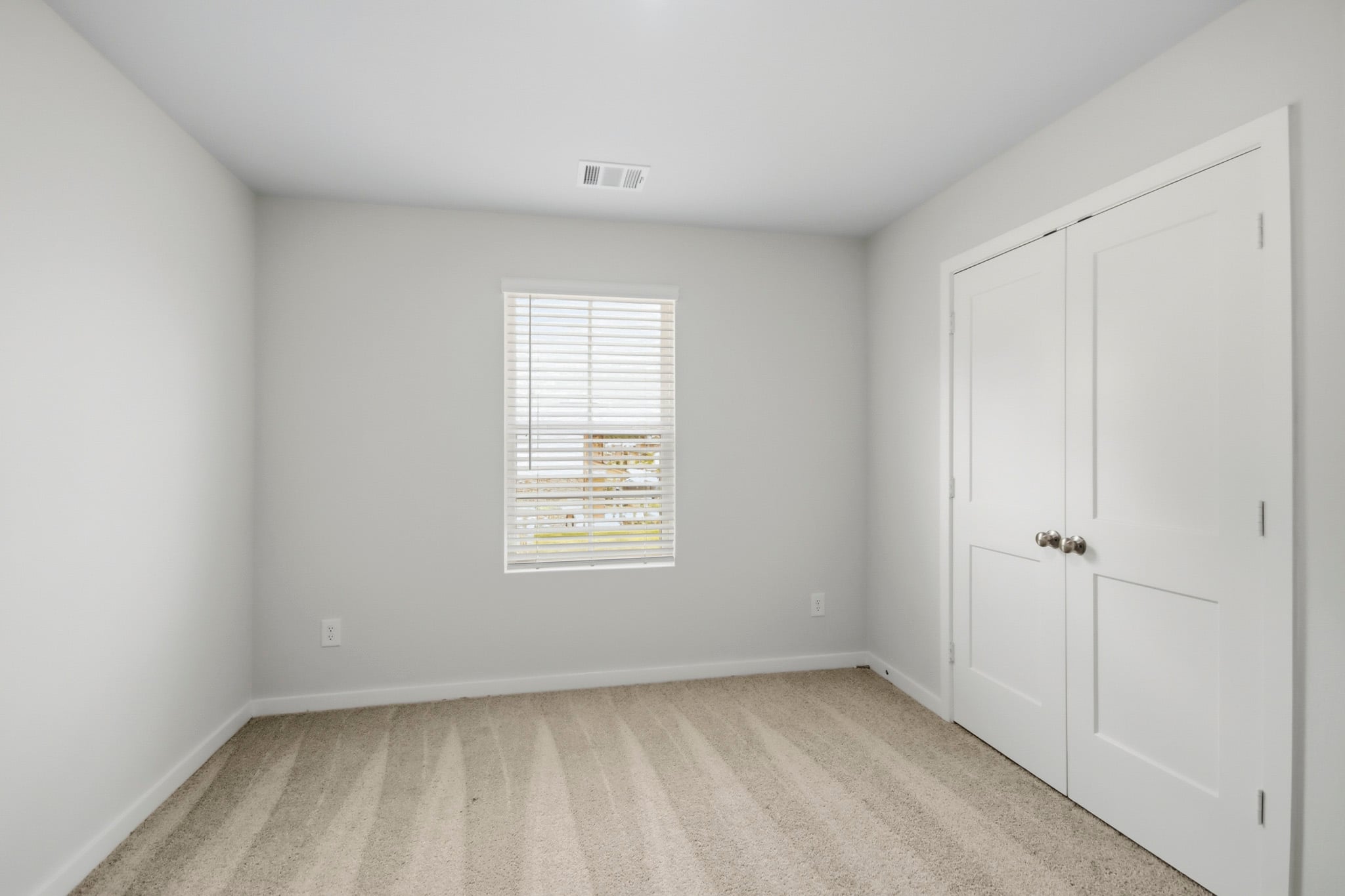 A room with white doors.