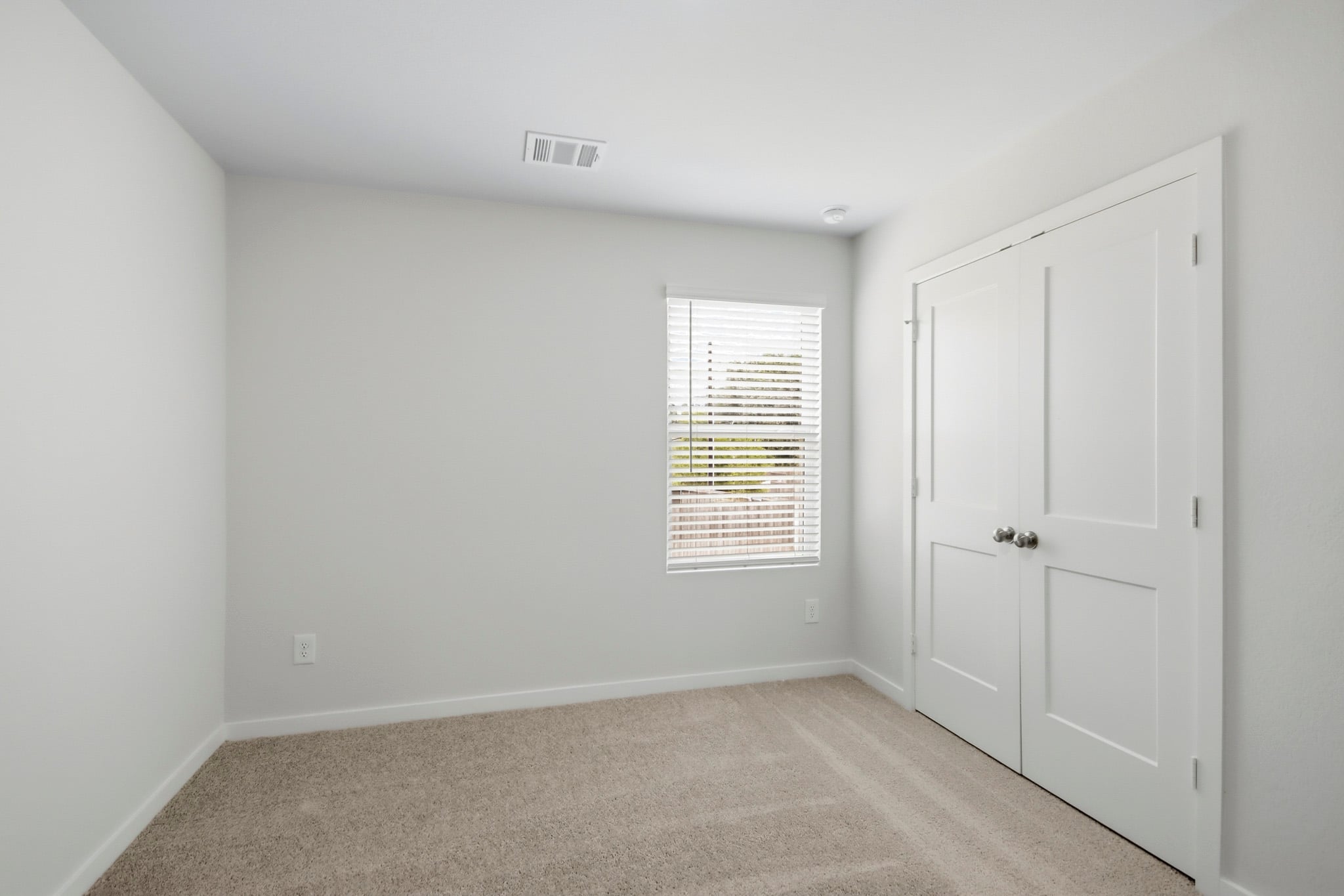A room with white doors.