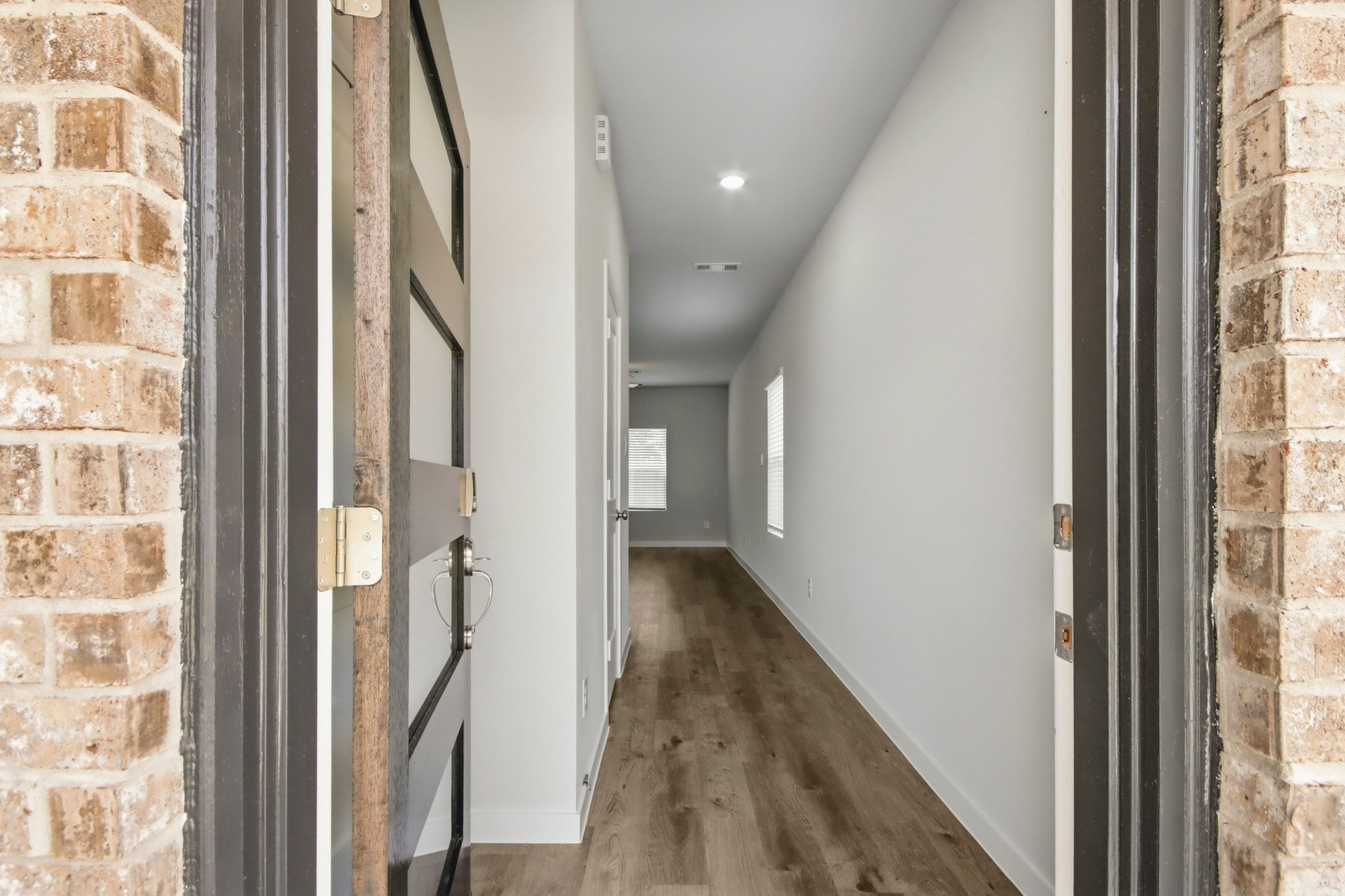 A hallway with brick walls.
