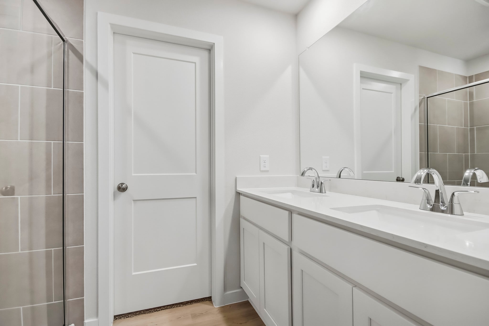 A bathroom with a glass shower.