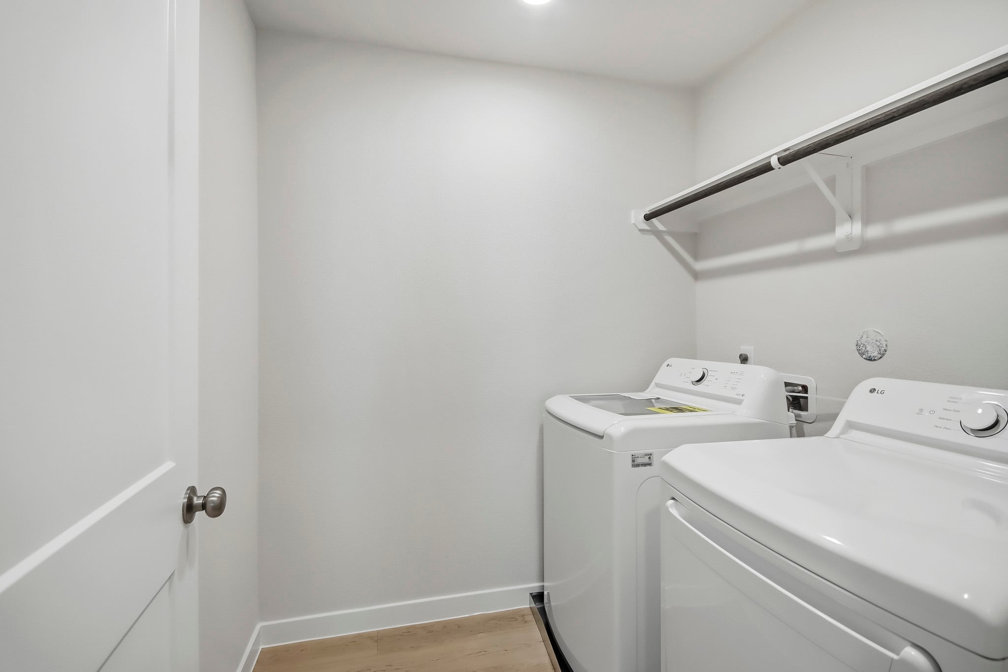 A bathroom with a sink and a shower unit.