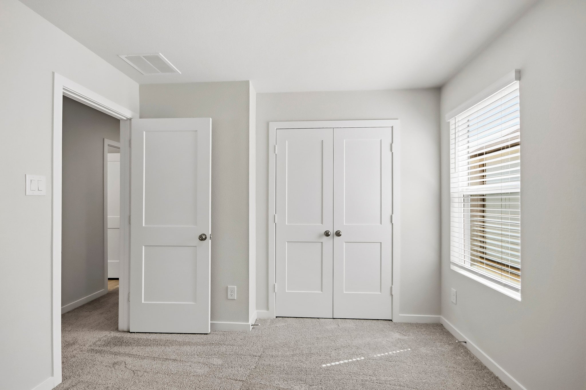 A room with white doors.