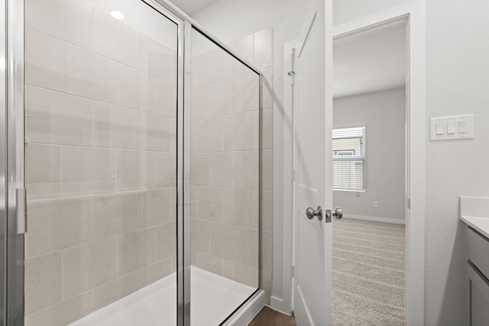 A bathroom with a glass shower.