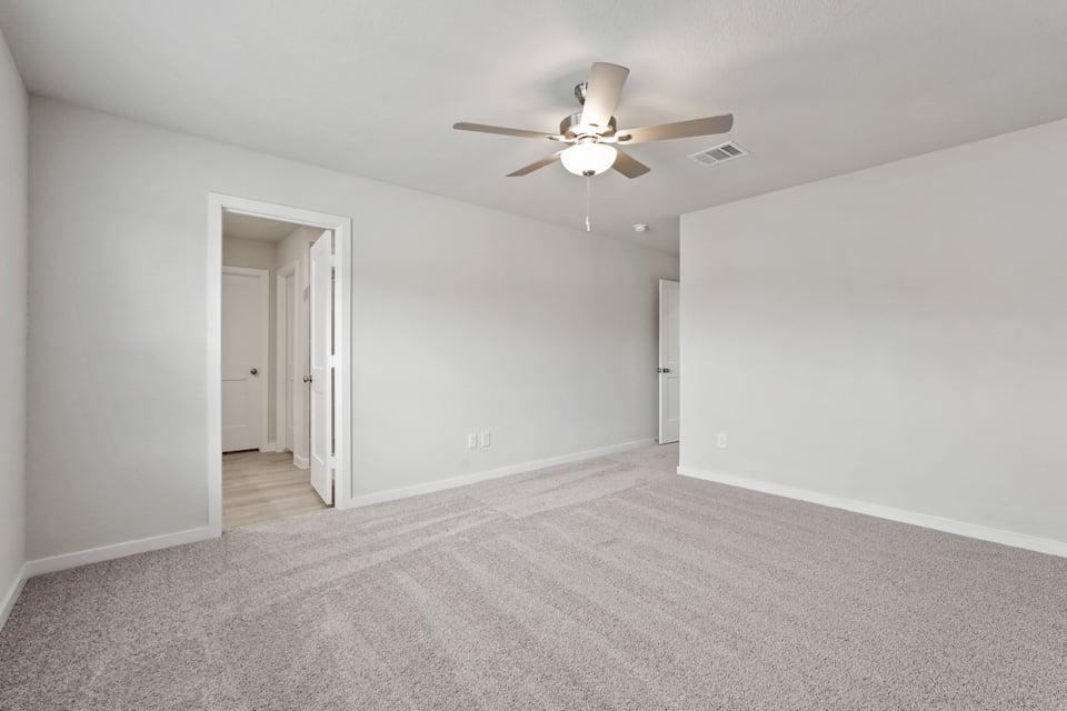 A room with a ceiling fan and a ceiling fan.
