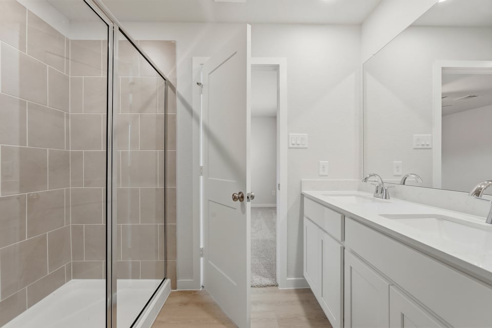 A bathroom with a glass shower.