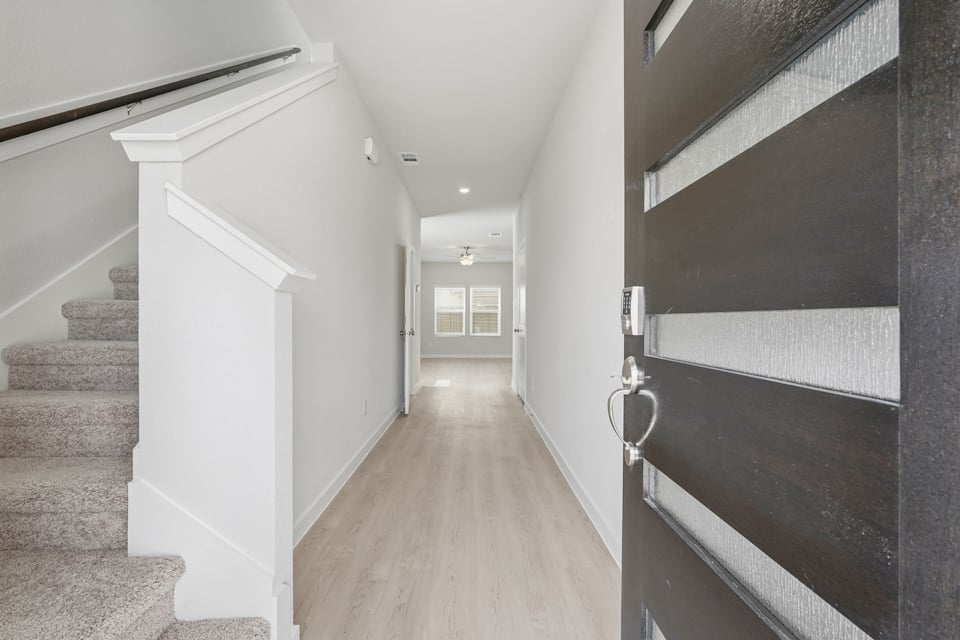 A hallway with black walls.