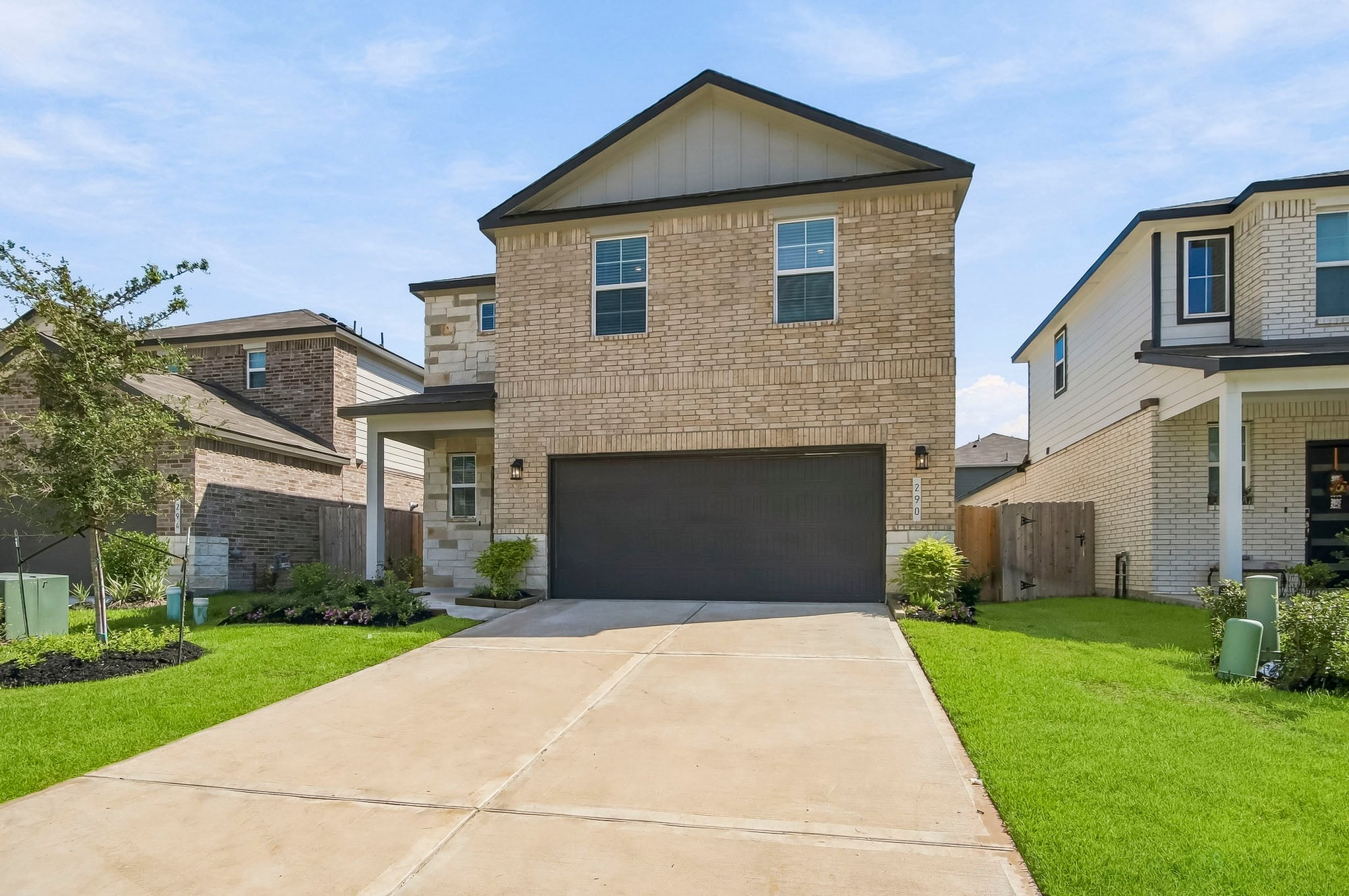 A driveway leading to a house.