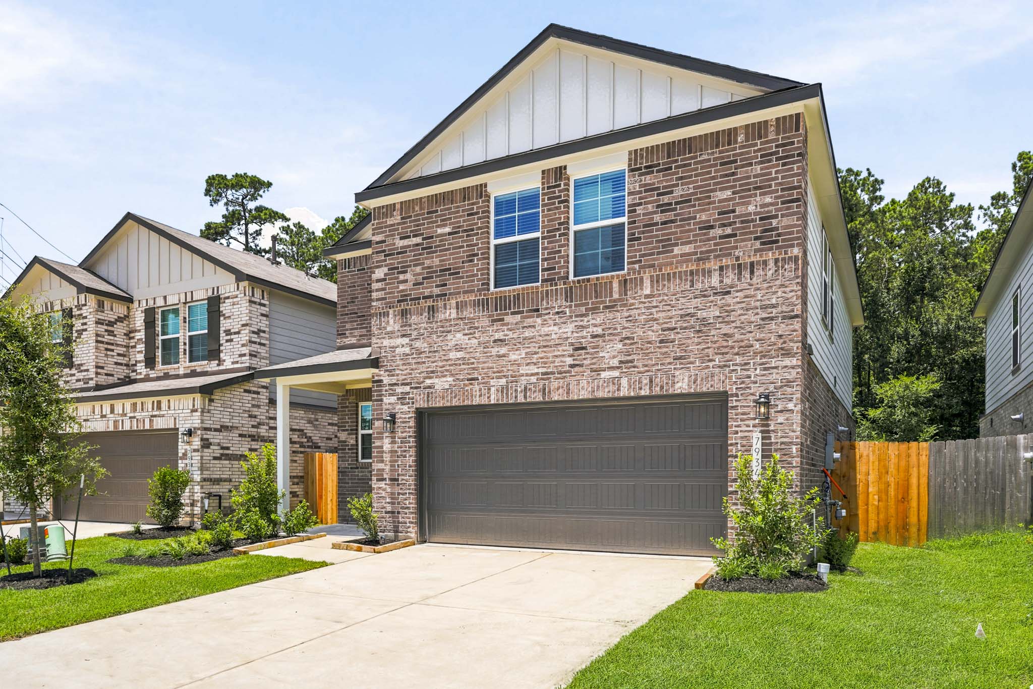 A brick house with a garage.