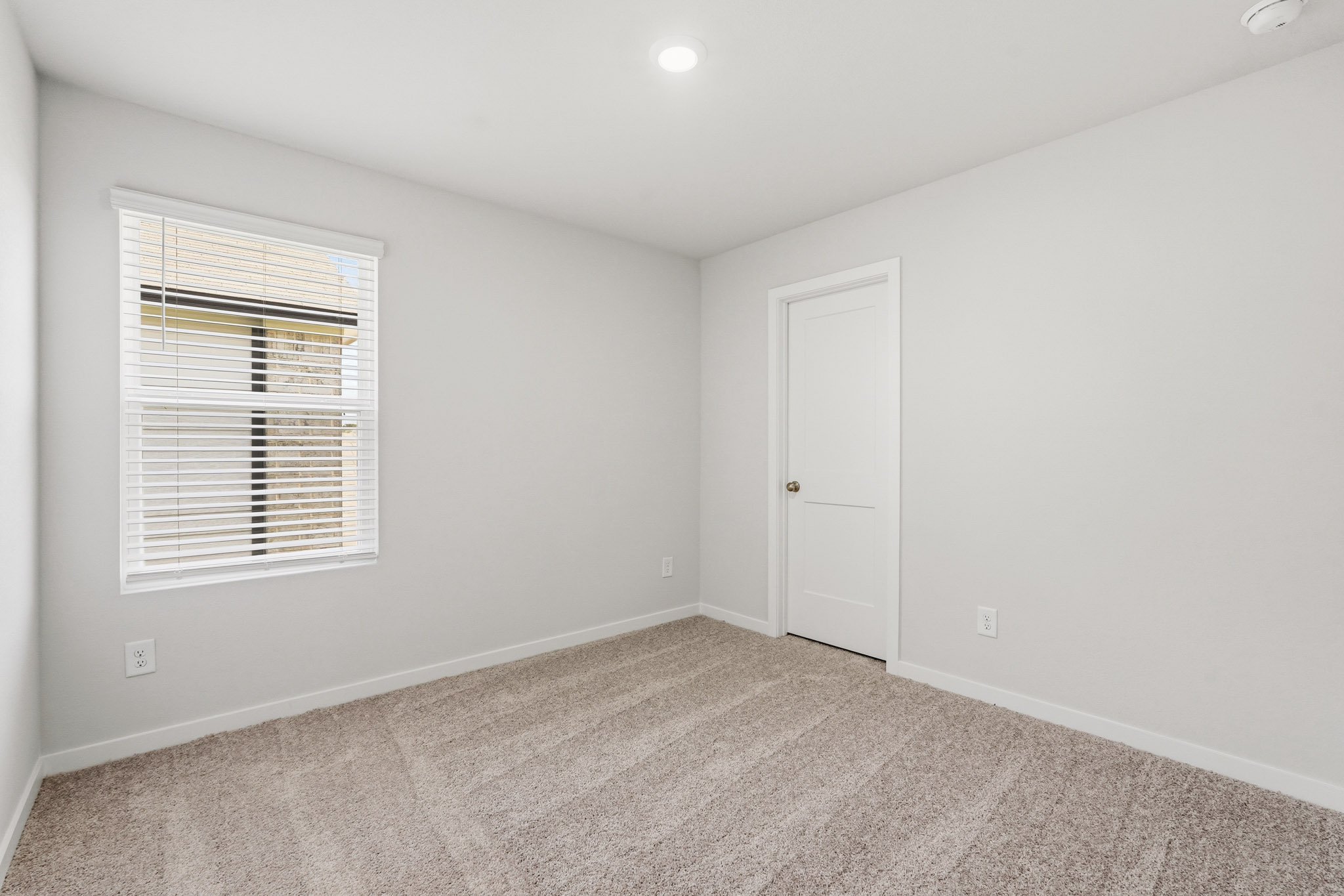A room with a door and a window.