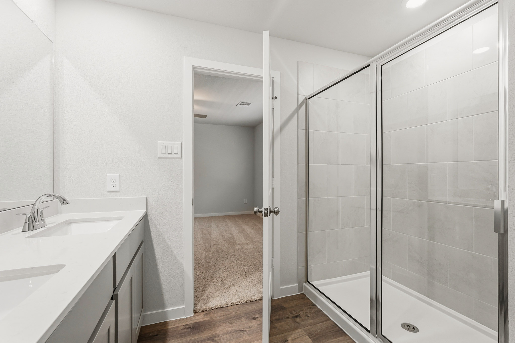 A bathroom with a glass shower.
