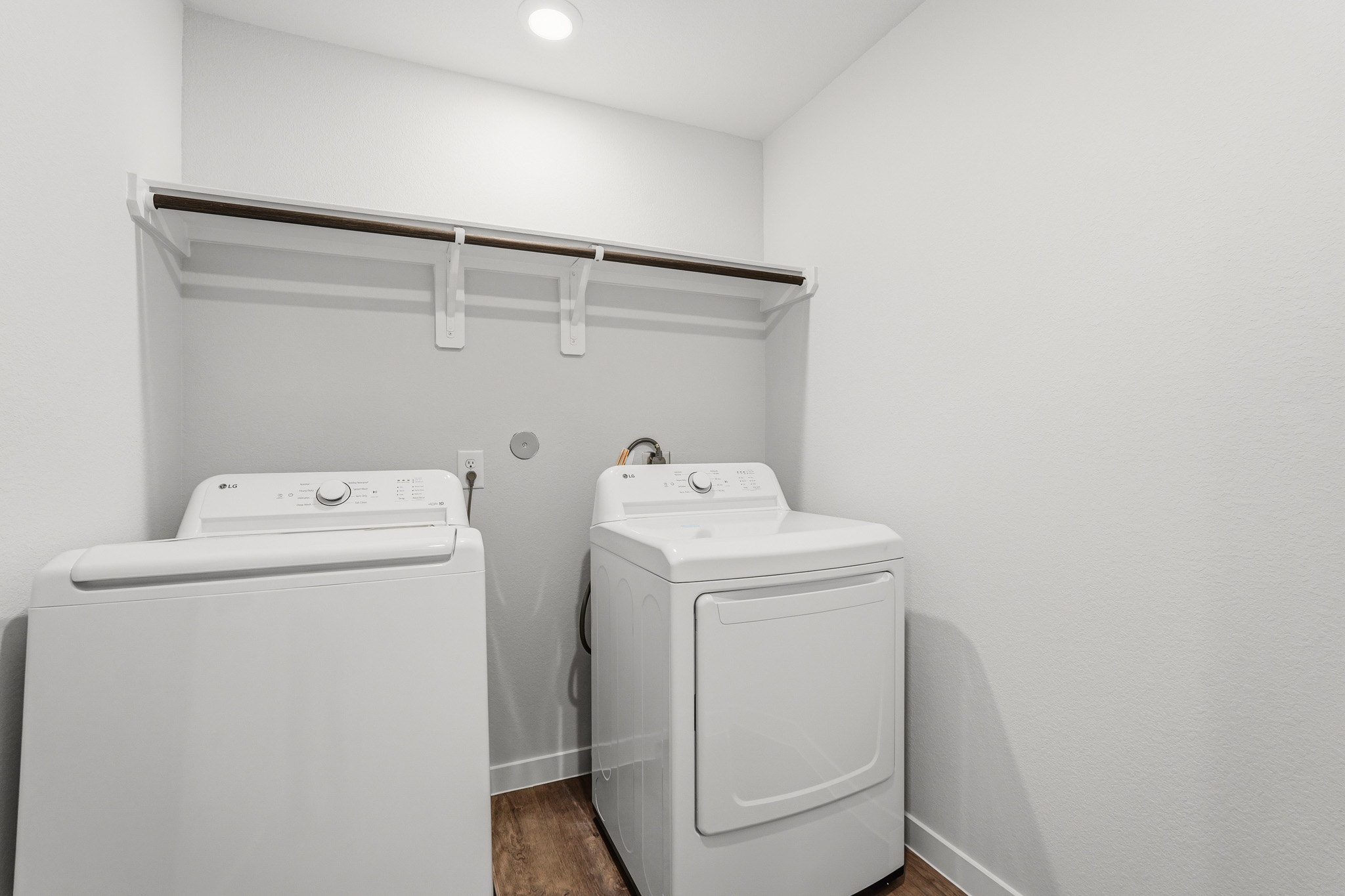 A washing machine in a room.