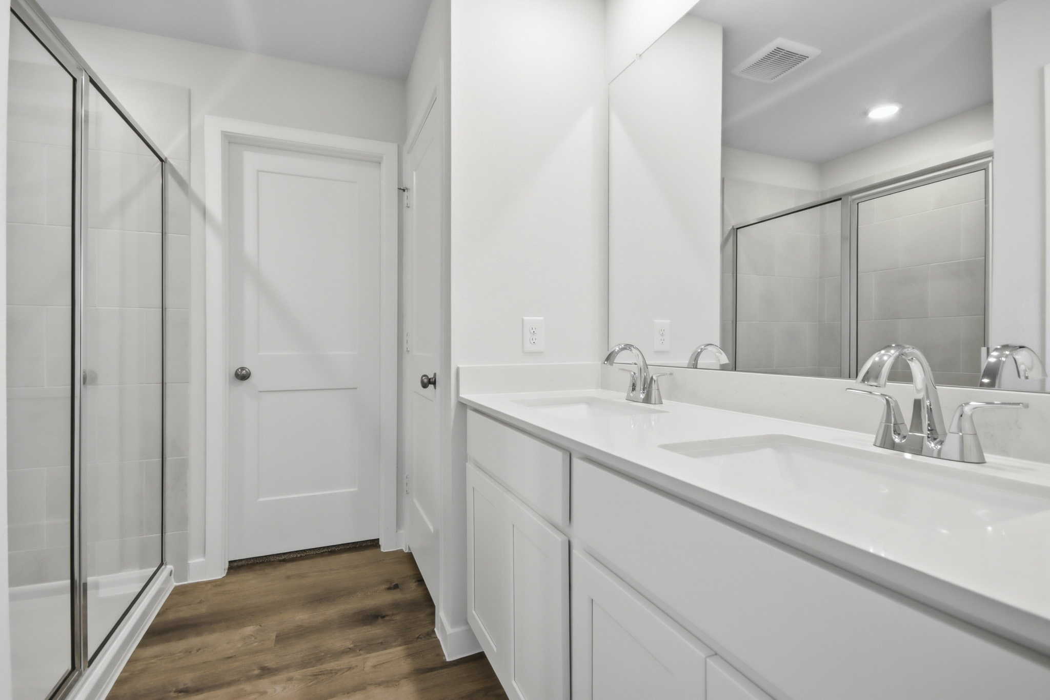 A bathroom with a glass shower.