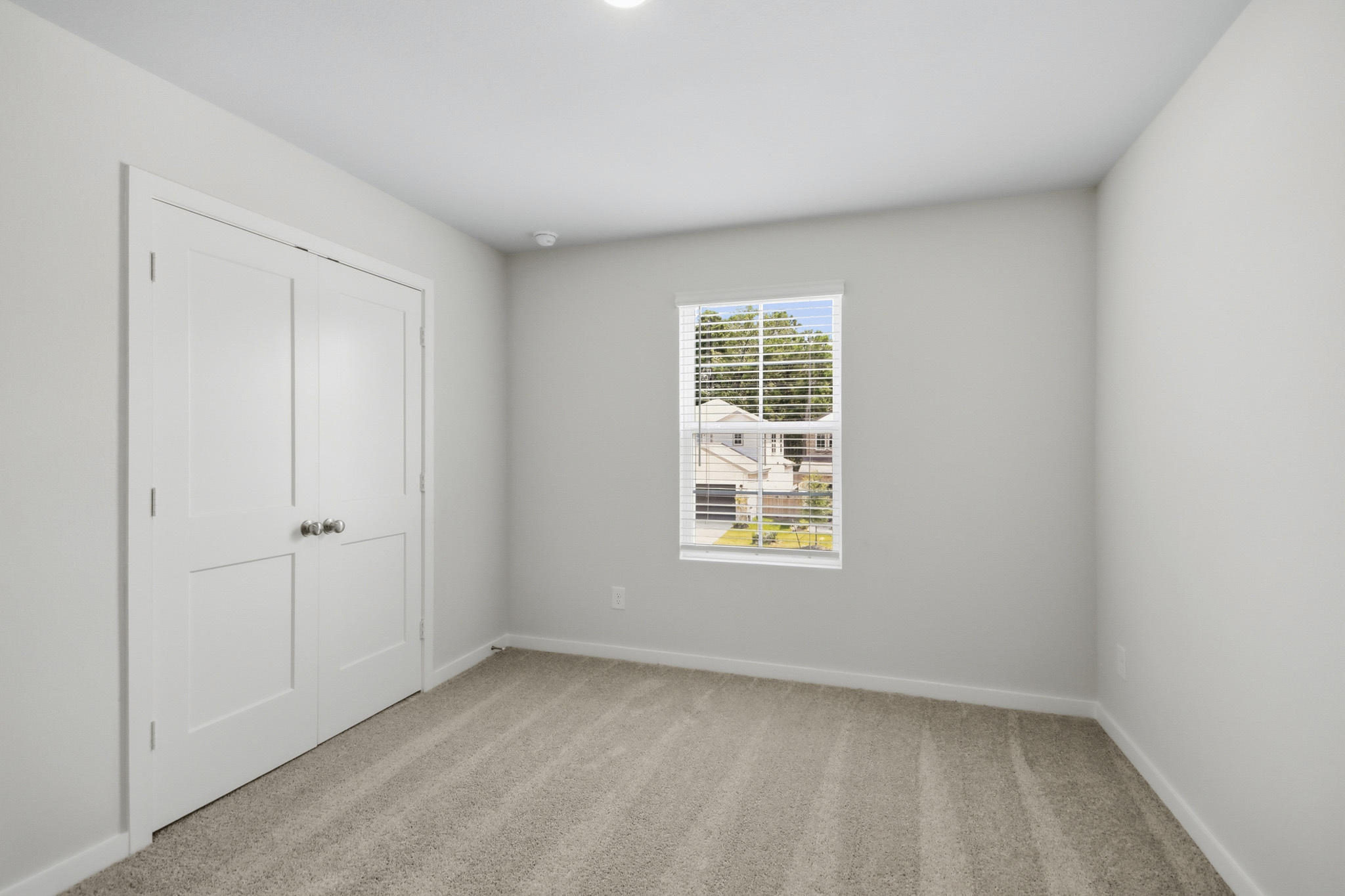A room with white doors.