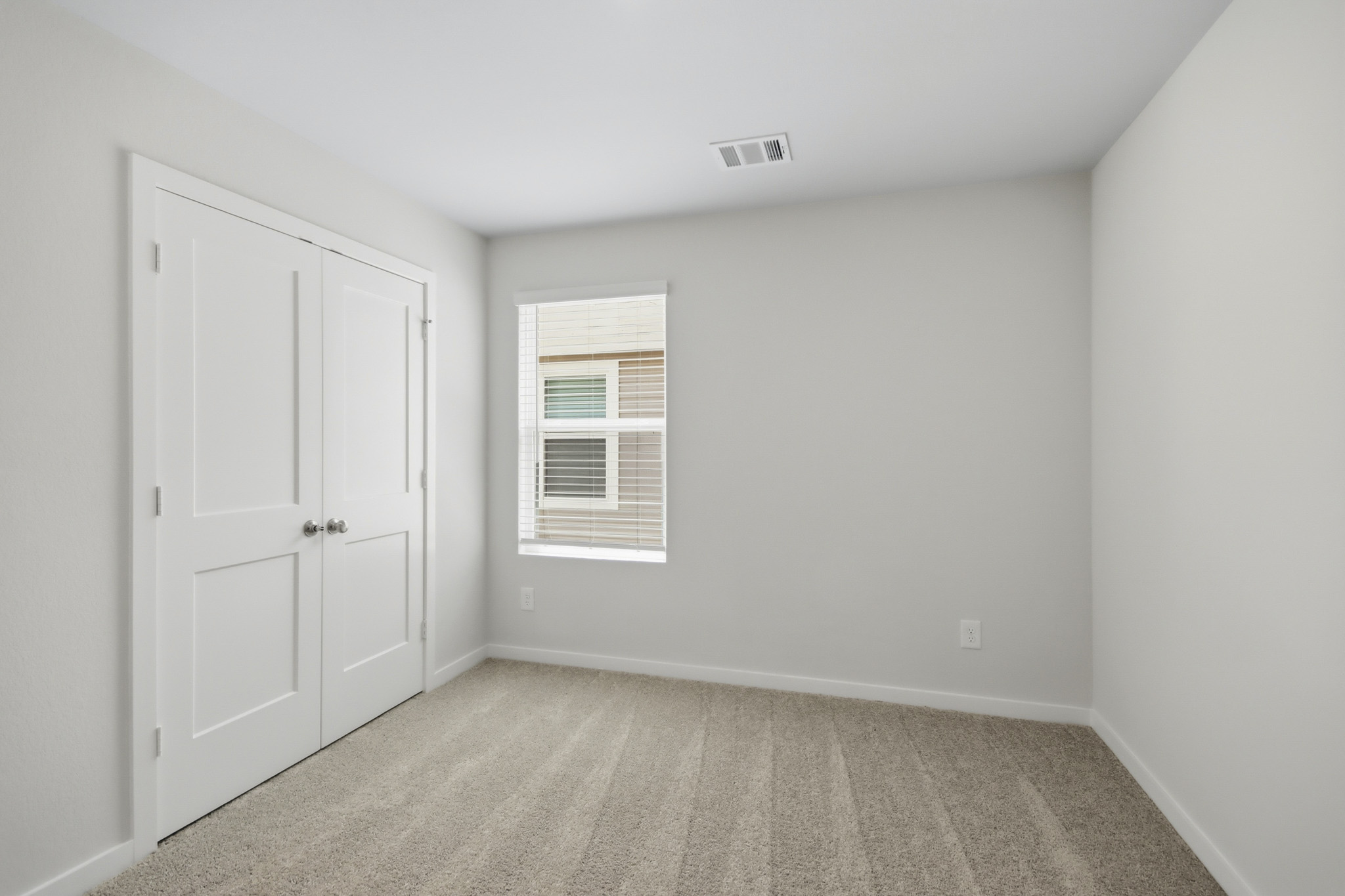 A room with white doors.