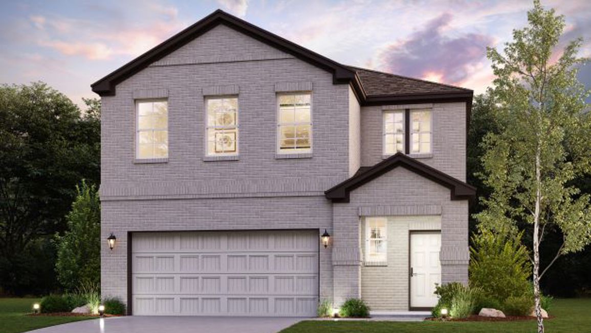 A house with a garage and trees.
