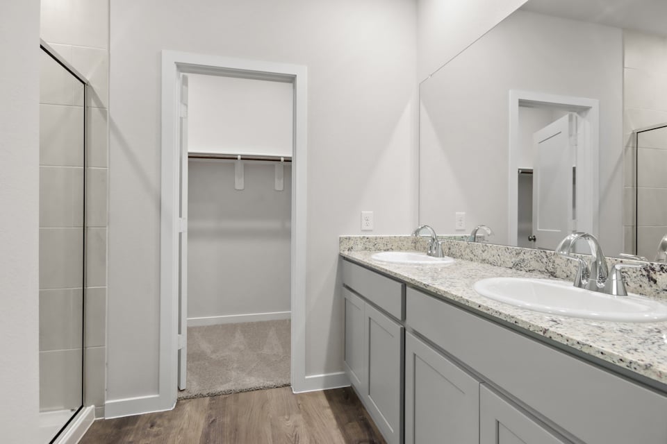 A bathroom with a glass shower.