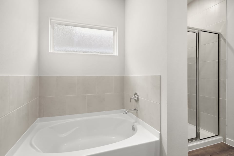 A bathtub in a bathroom.