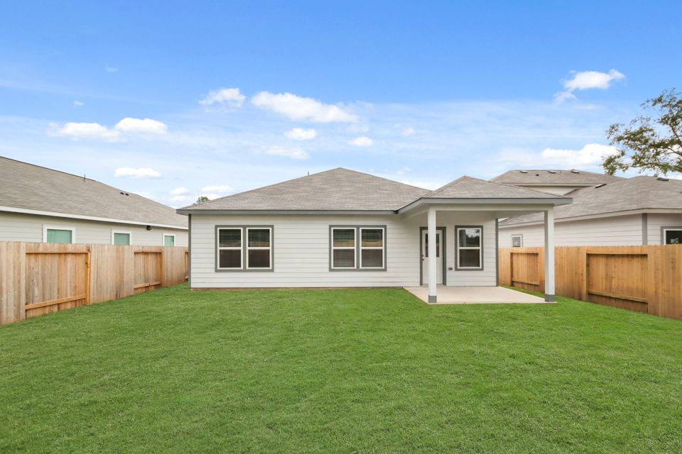 A house with a green lawn.