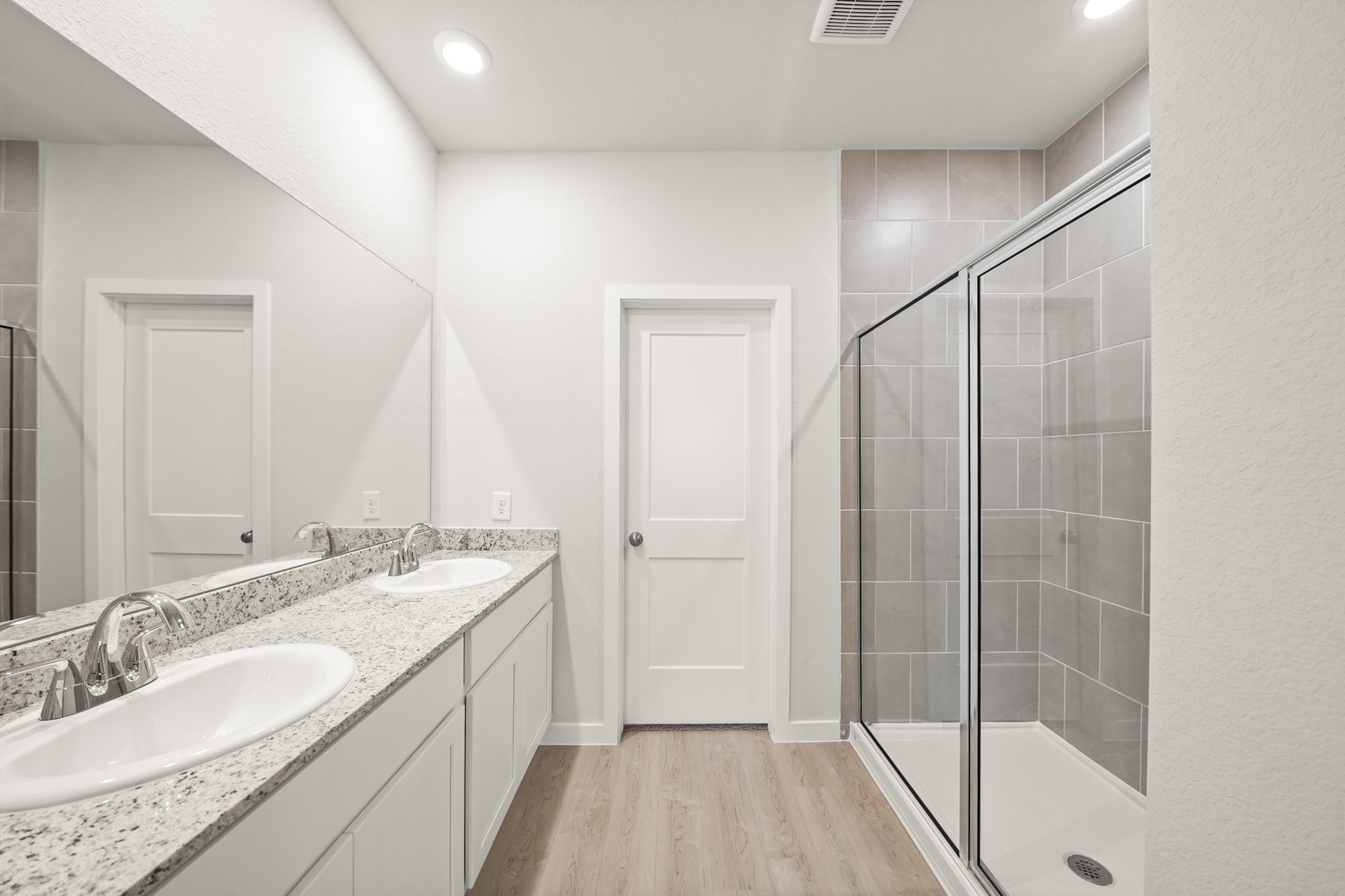 A bathroom with a glass shower.
