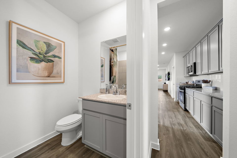 A bathroom with a toilet and sink.