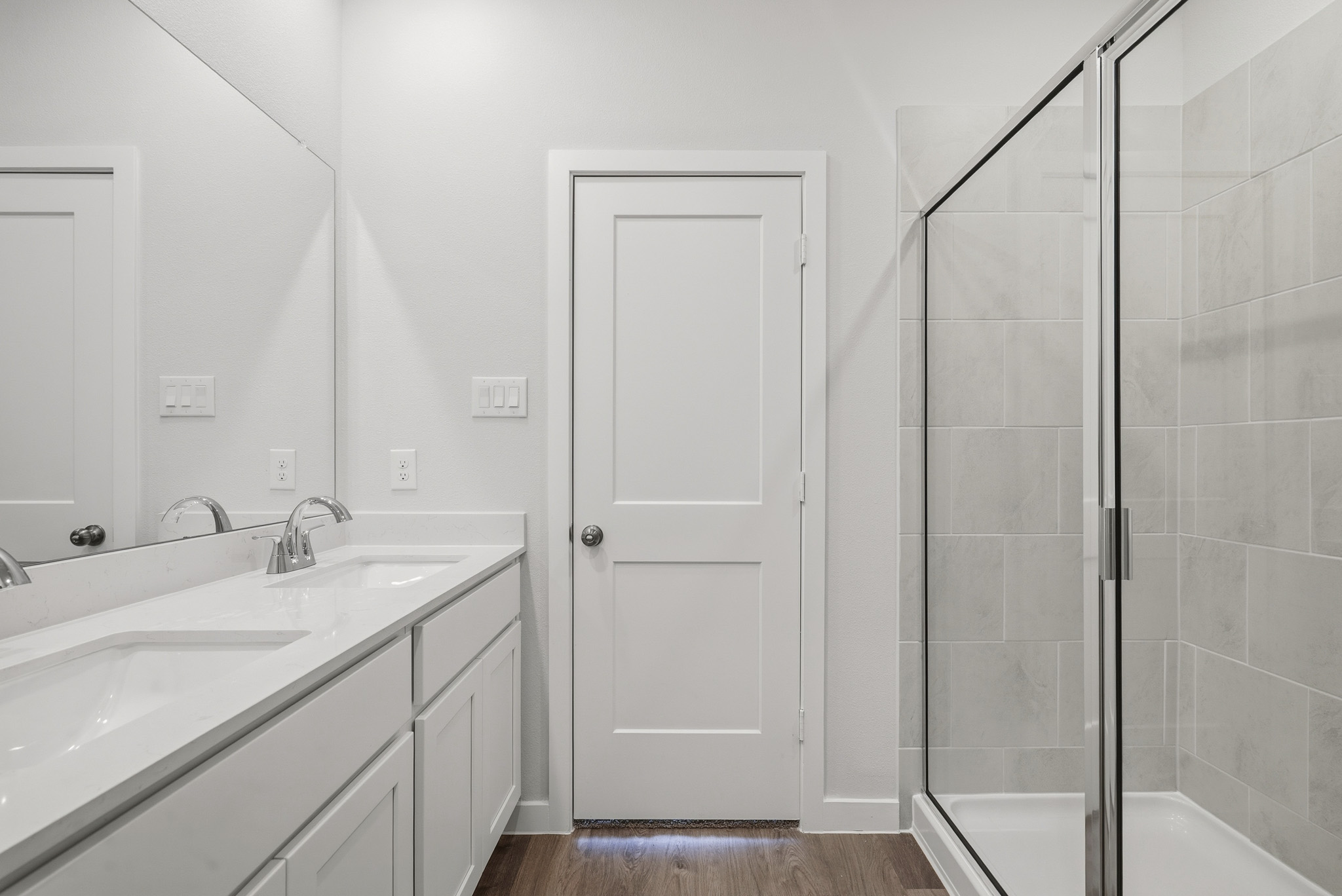 A bathroom with a glass shower.