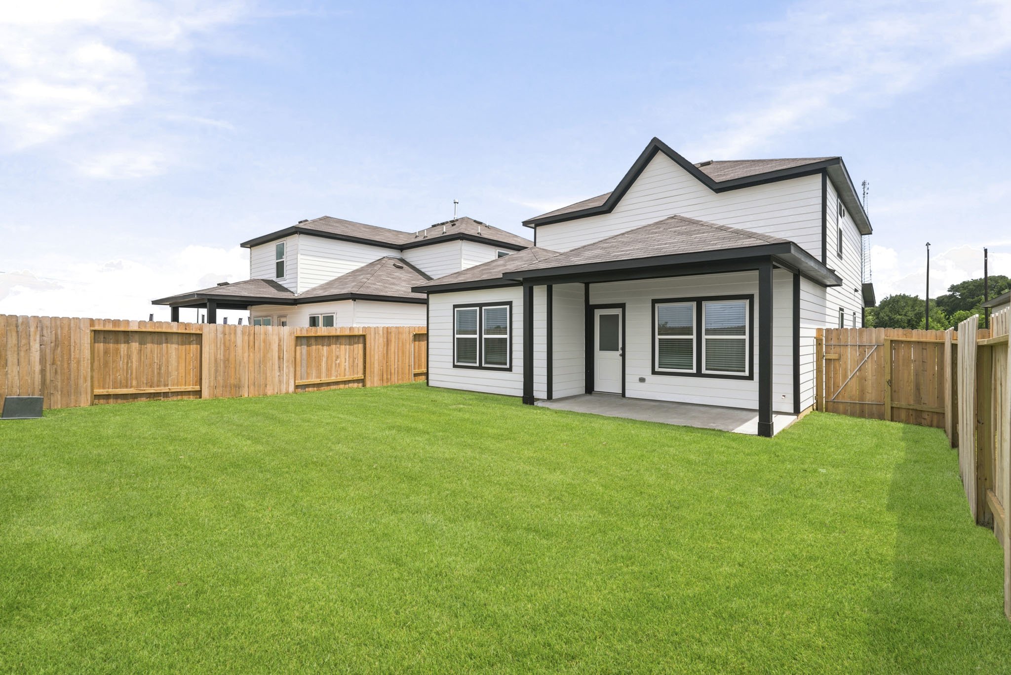A house with a fence around it.