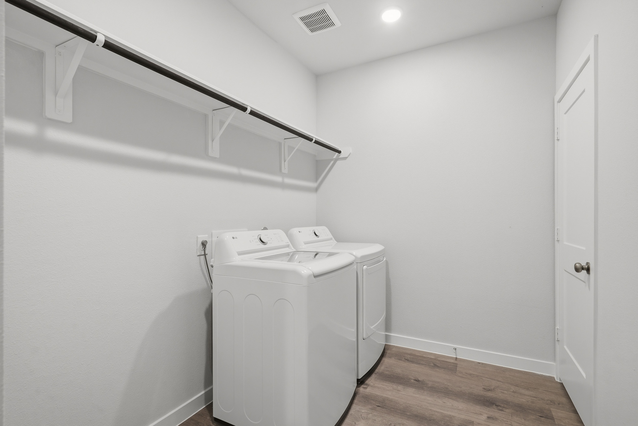 A washing machine in a room.