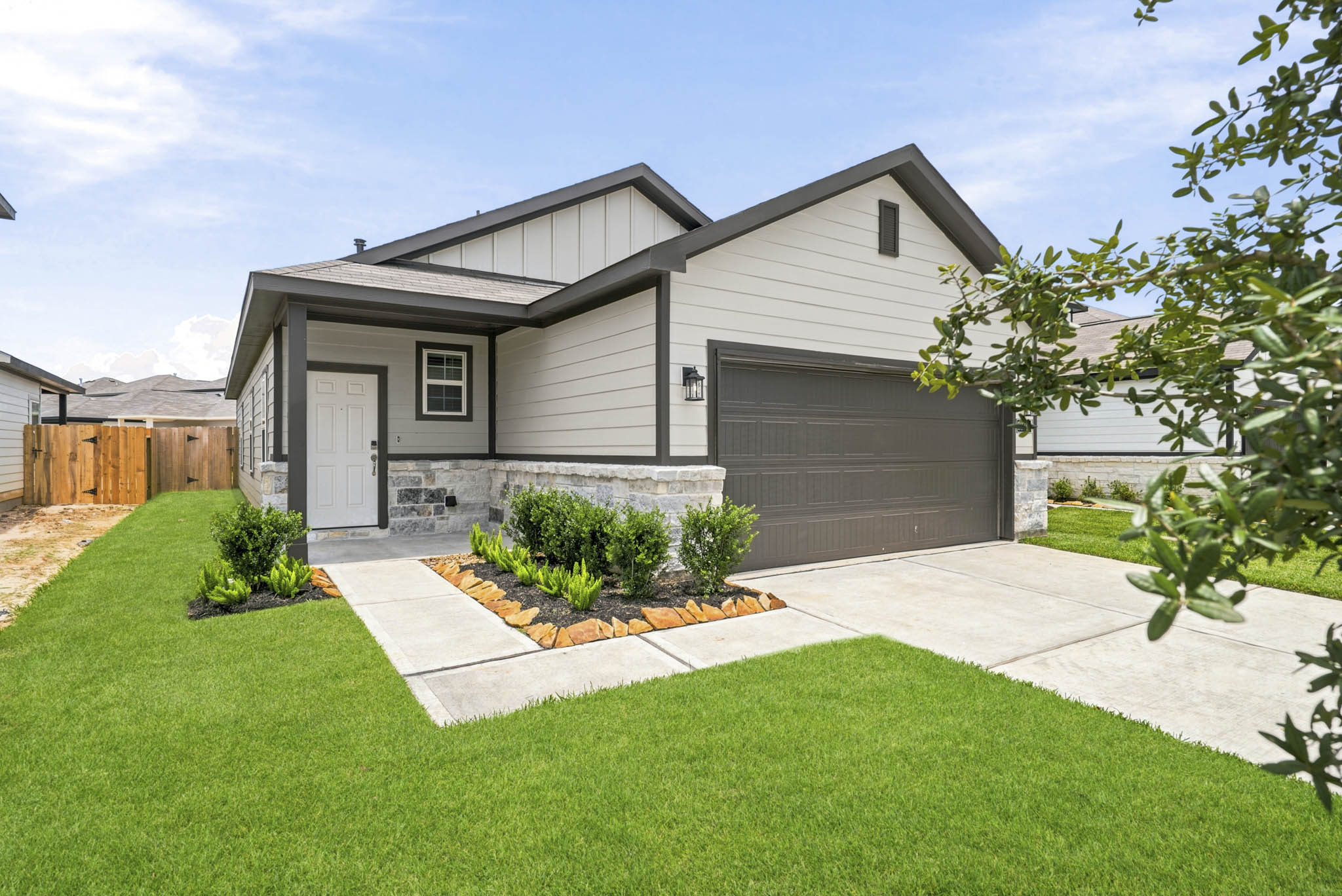 A house with a fence and a yard.