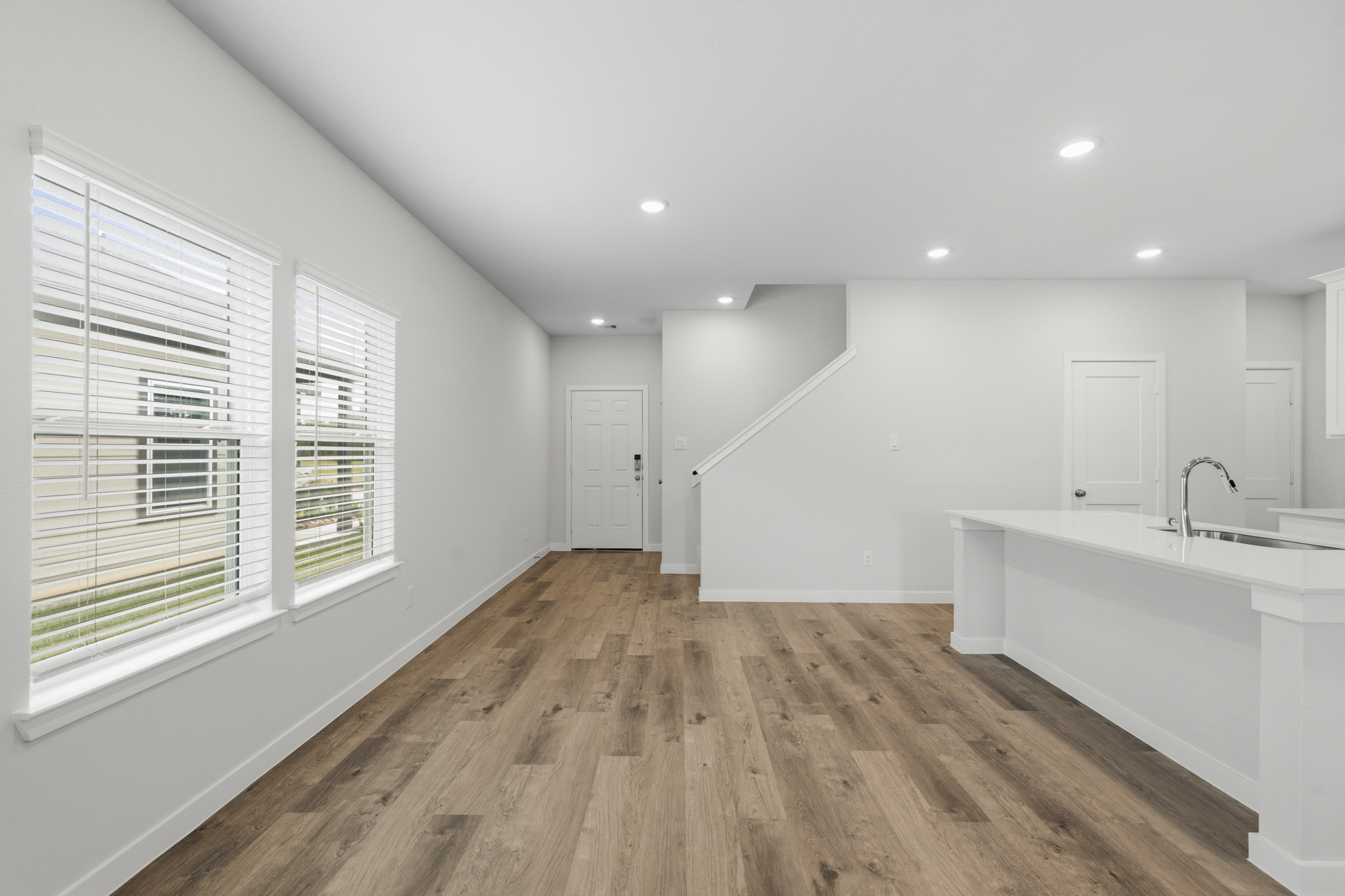 A bathroom with a wood floor.