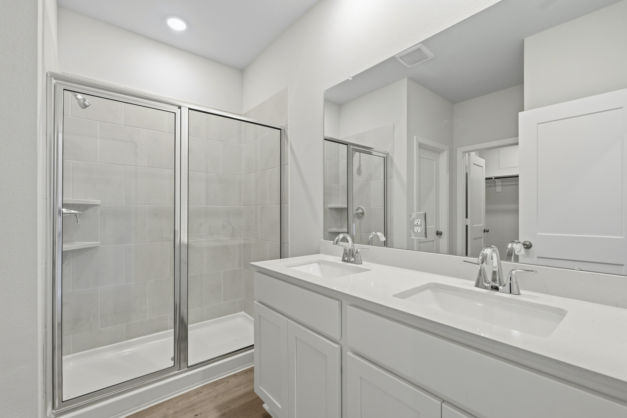 A bathroom with a glass shower.