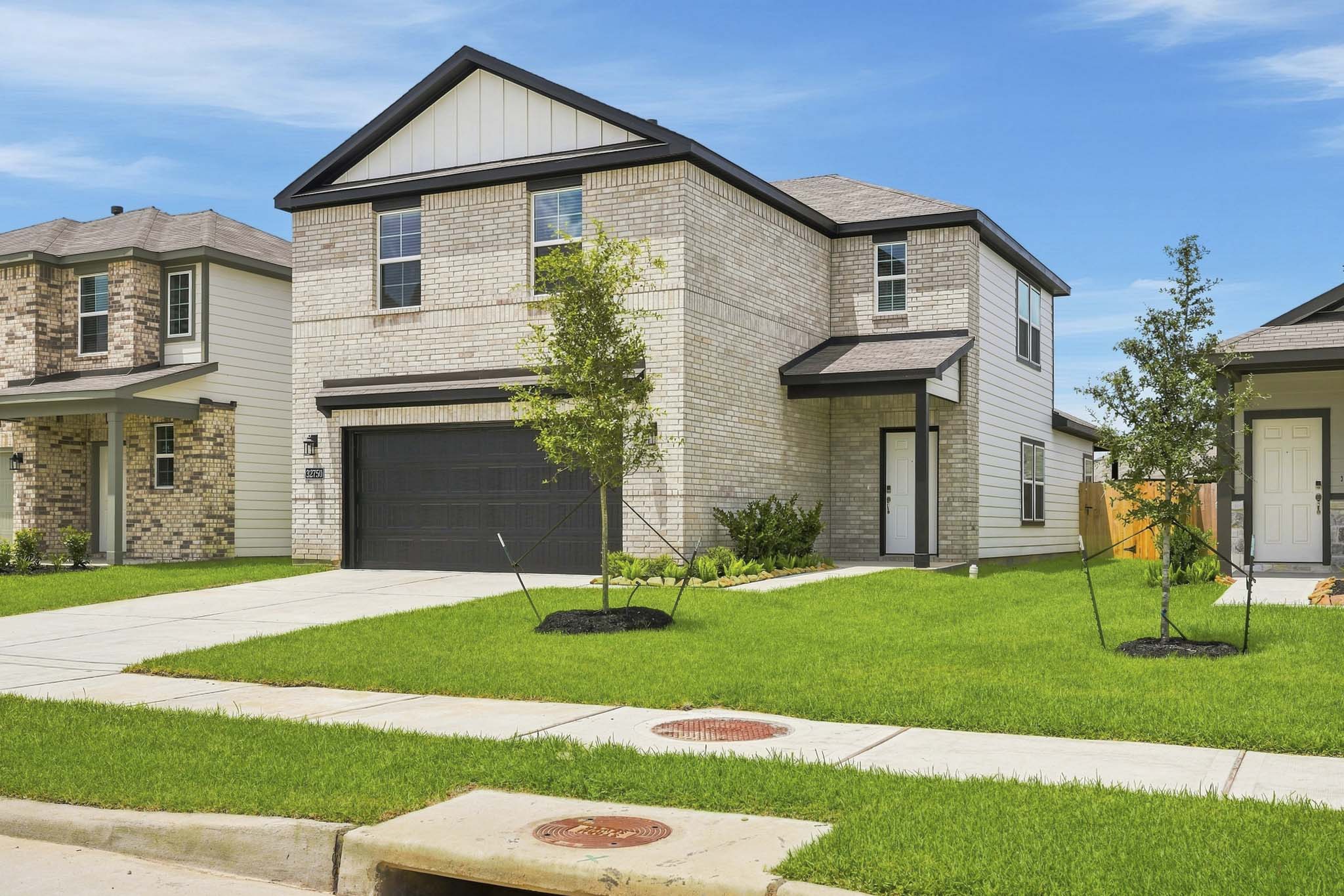 A large house with a driveway.