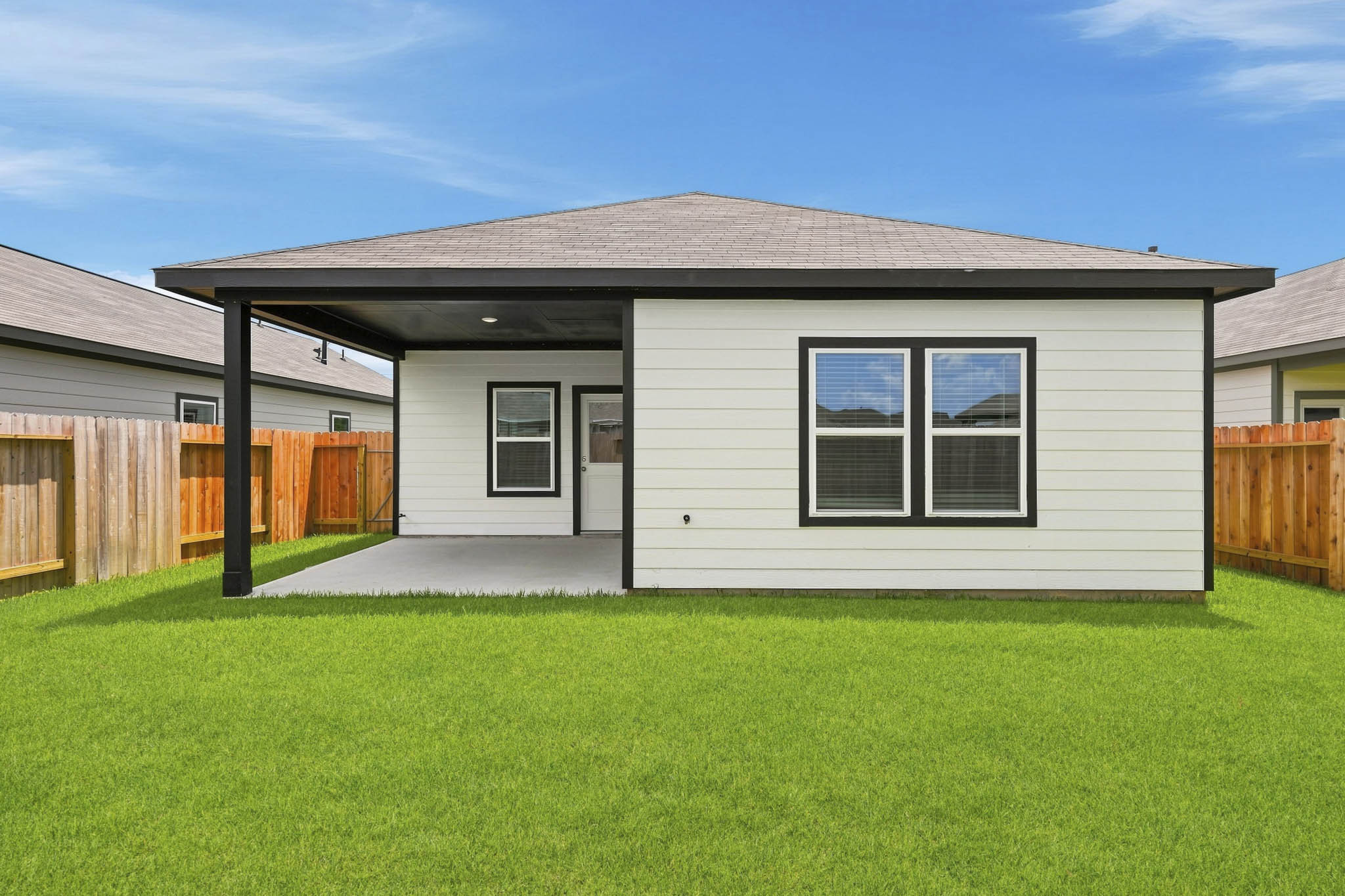 A house with a grass yard.