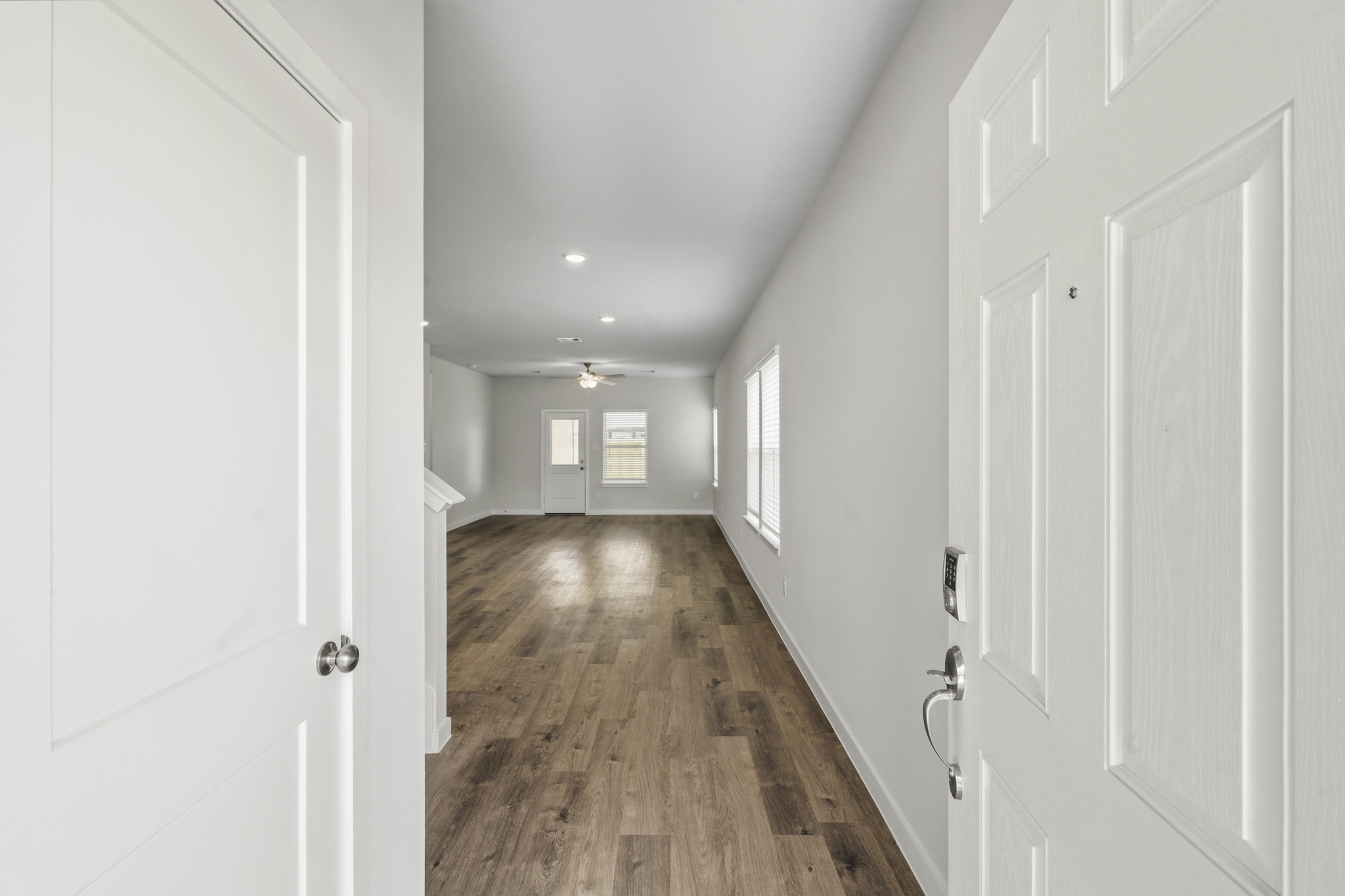 A hallway with white doors.