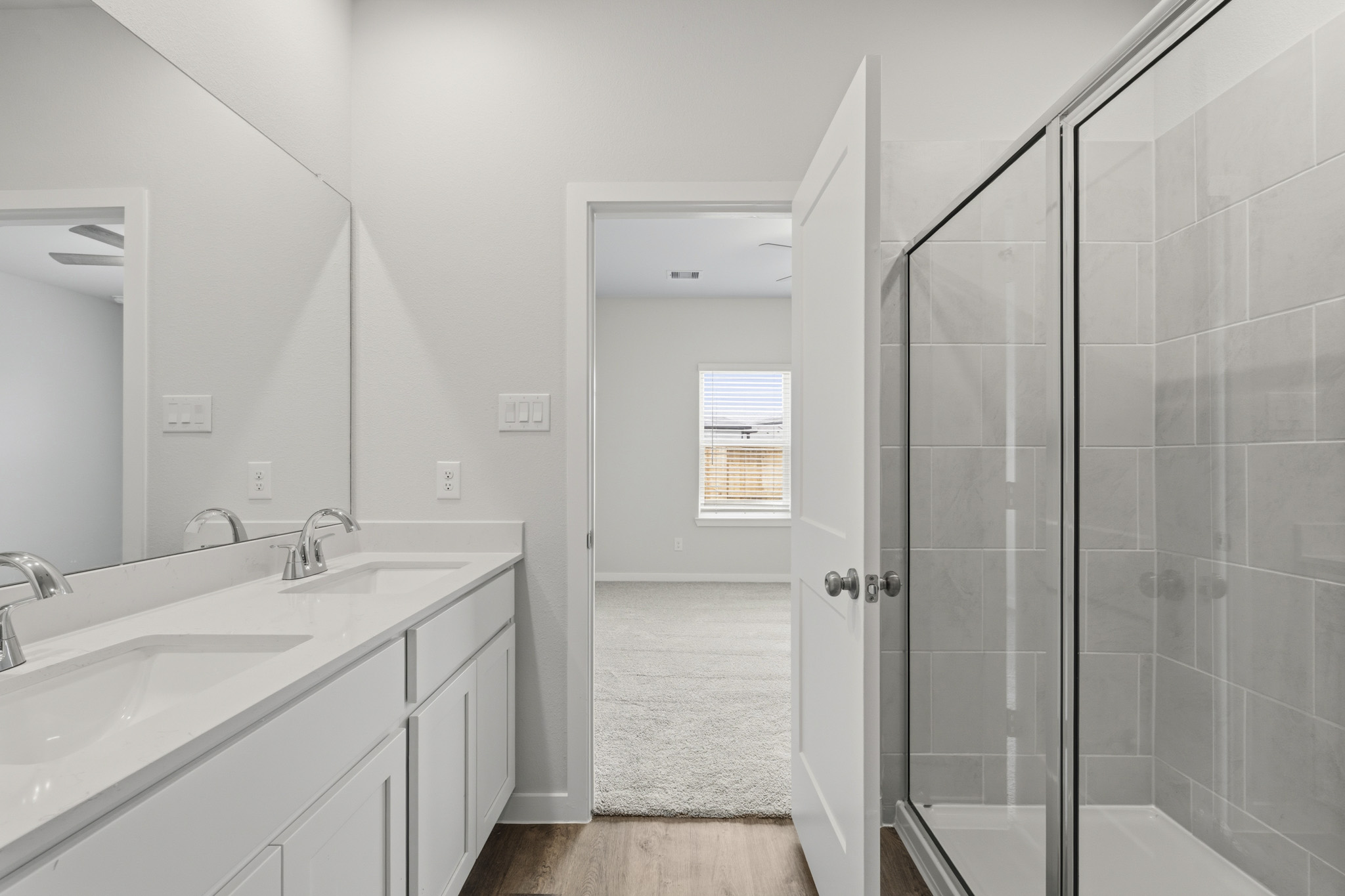 A bathroom with a glass shower.