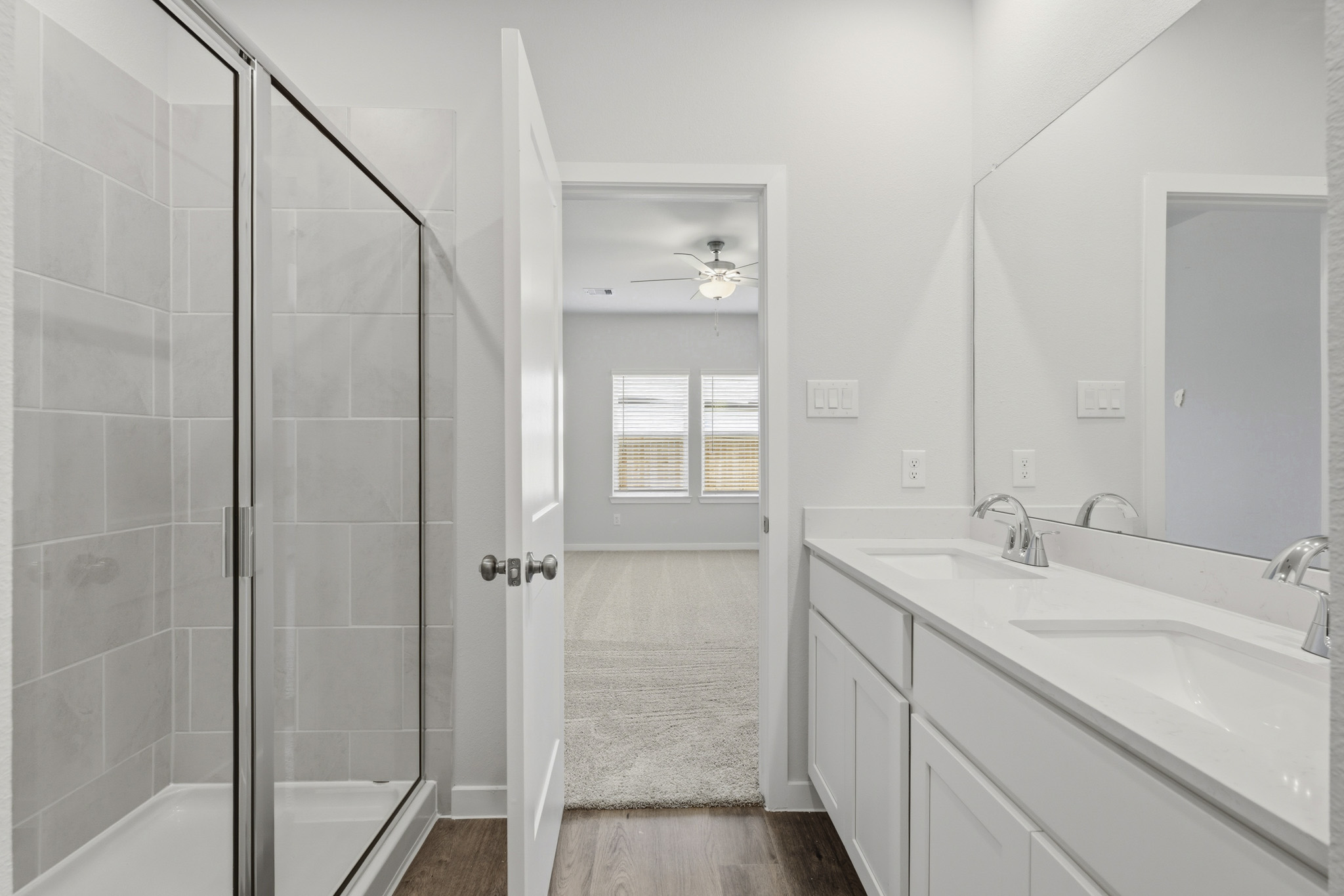 A bathroom with a glass shower.
