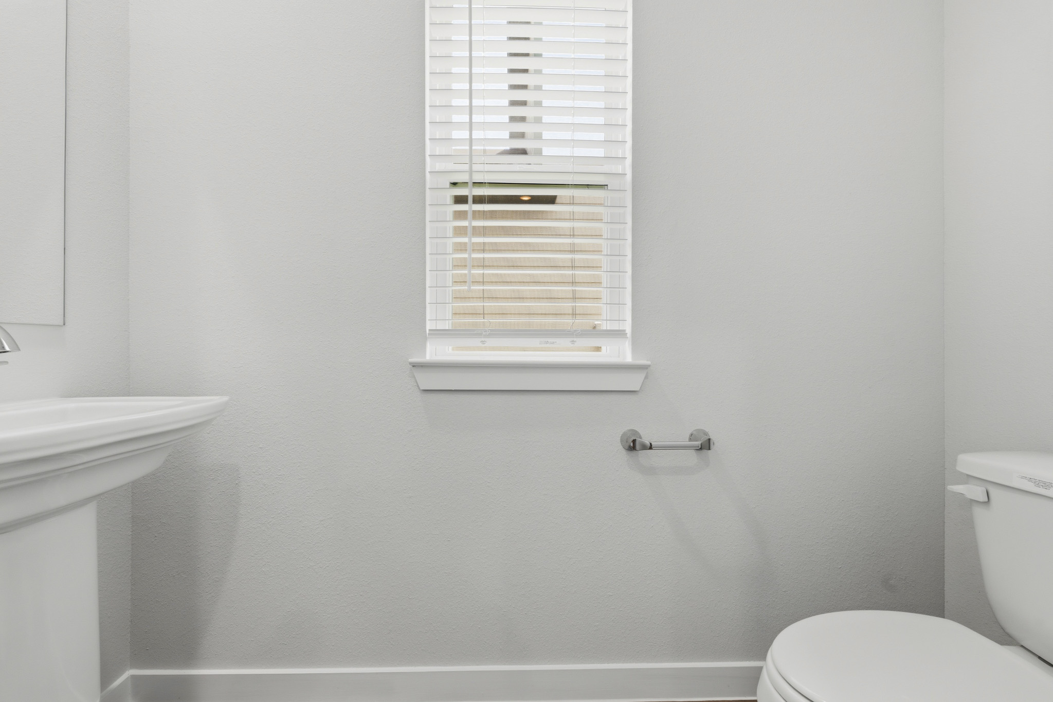 A bathroom with a window.