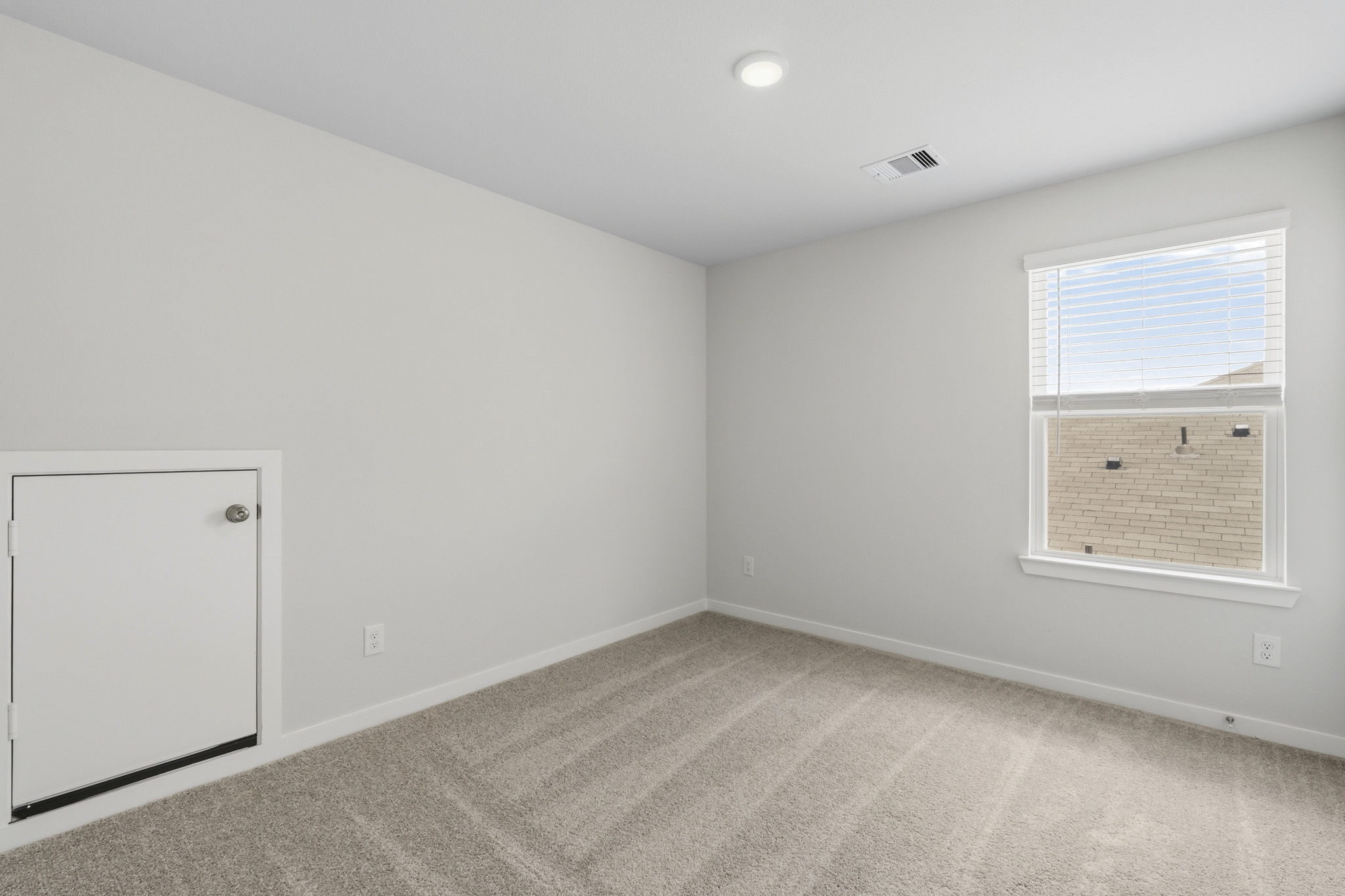 A room with a door and a window.