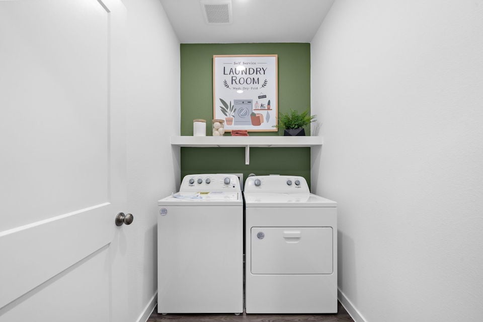 A white cabinet with a sign on it.