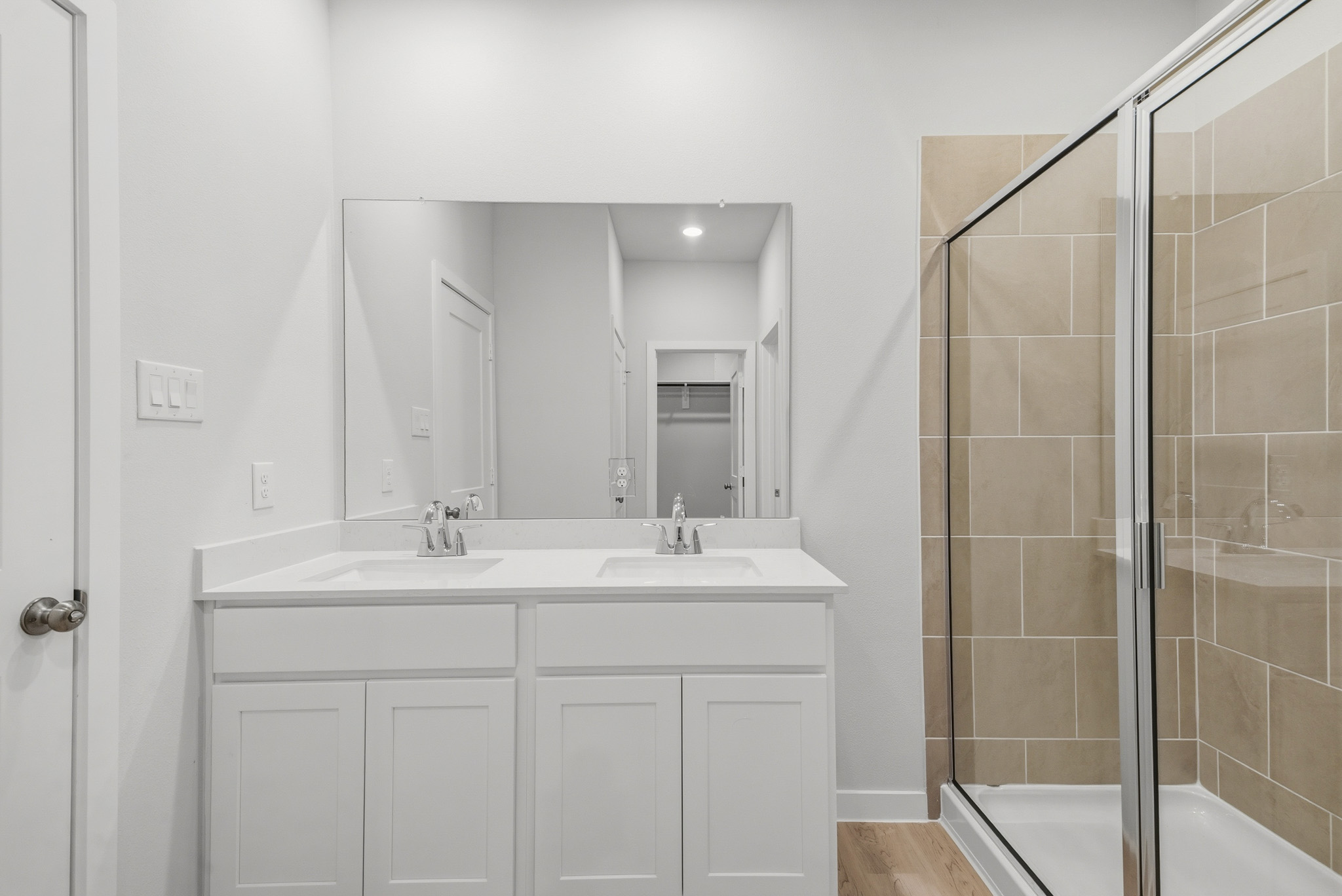 A bathroom with a glass shower.
