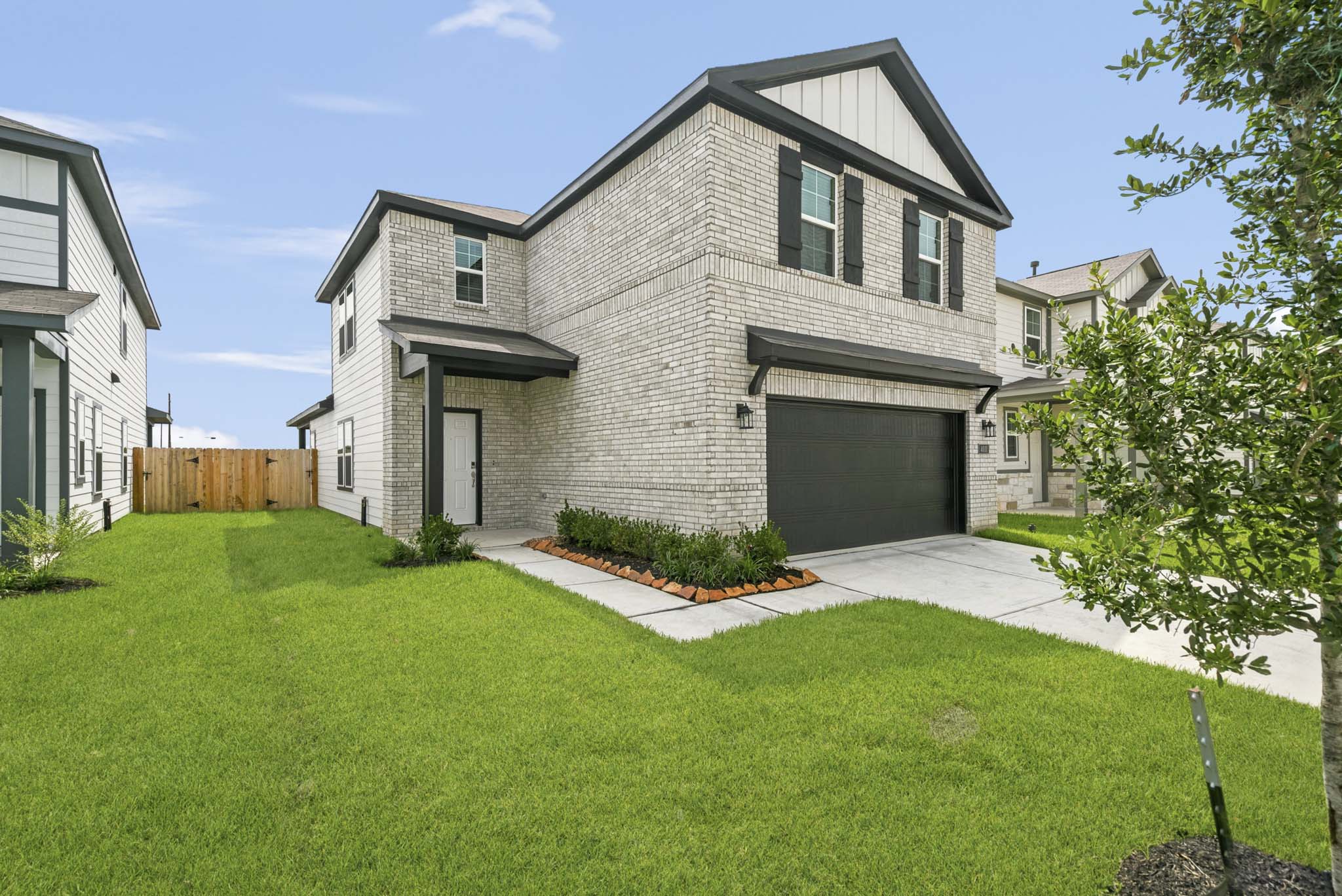A house with a green lawn.