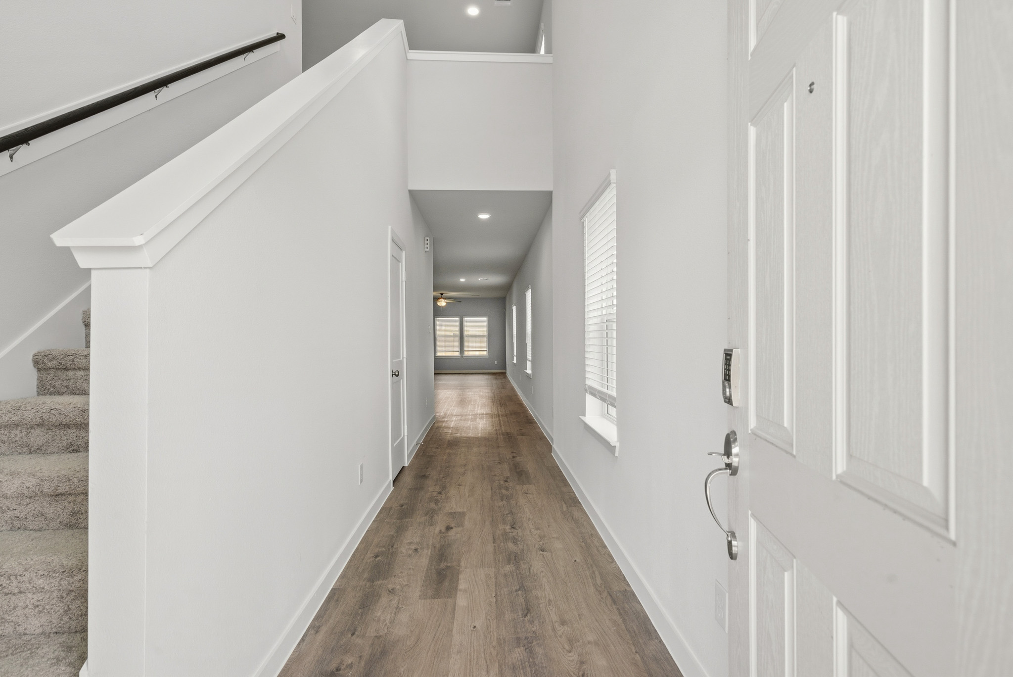 A hallway with white doors.