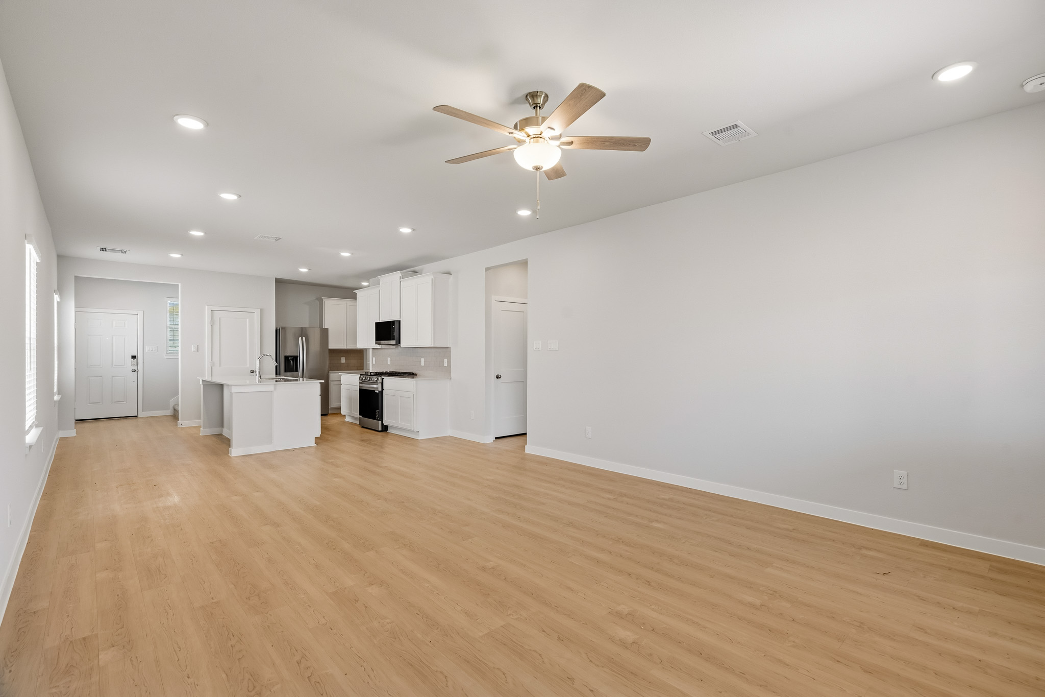 A large empty room with white walls.