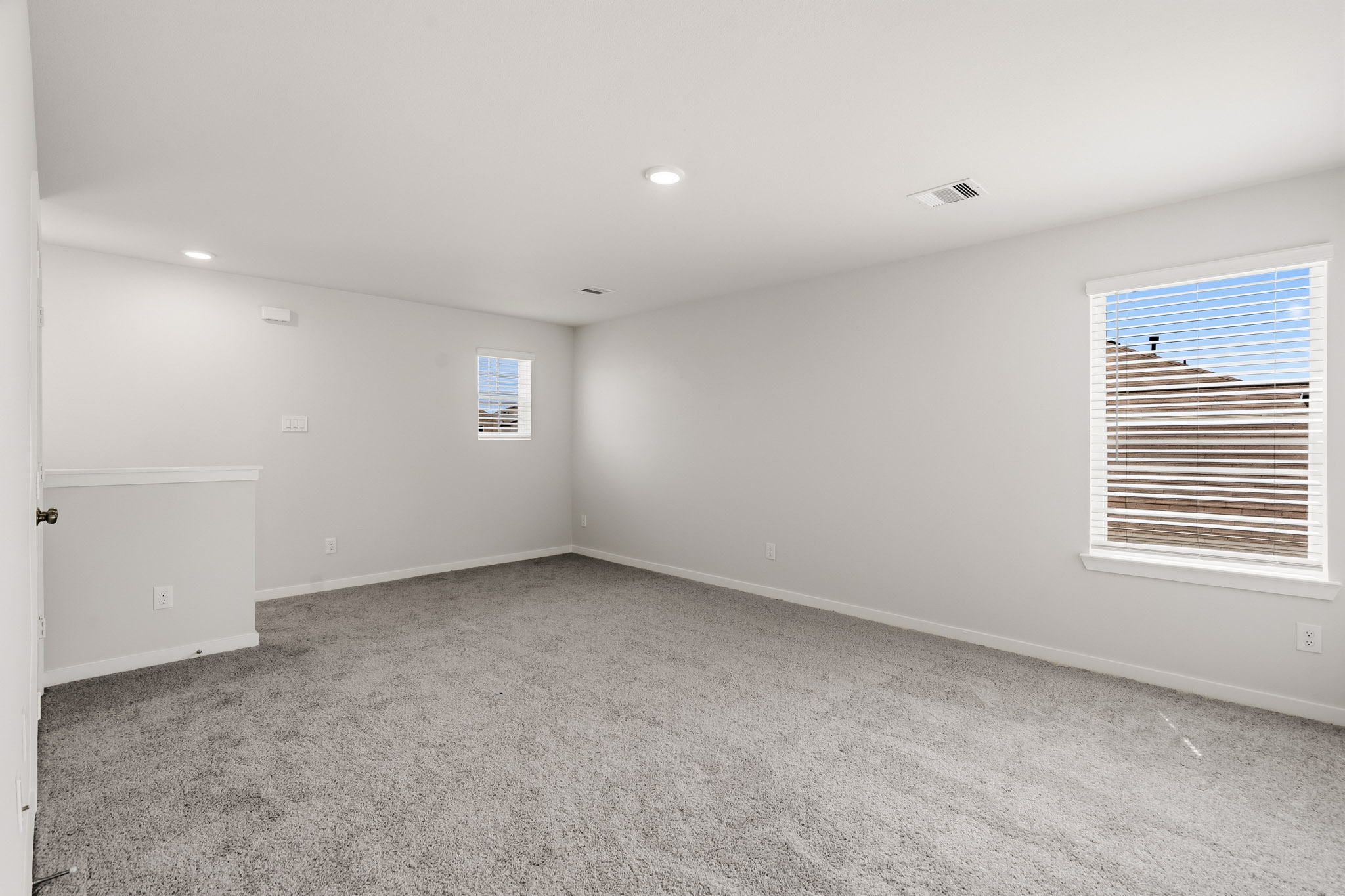 A room with a window and a door.