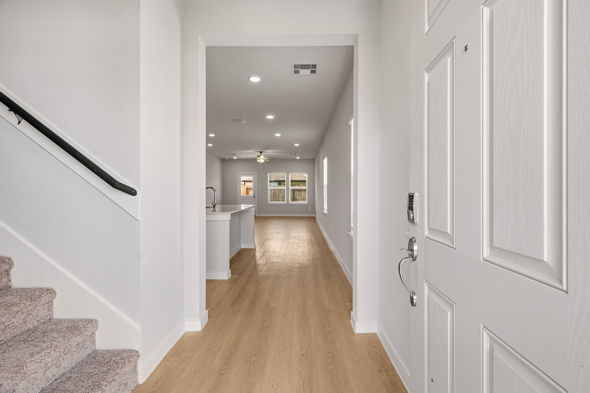 A hallway with white walls.
