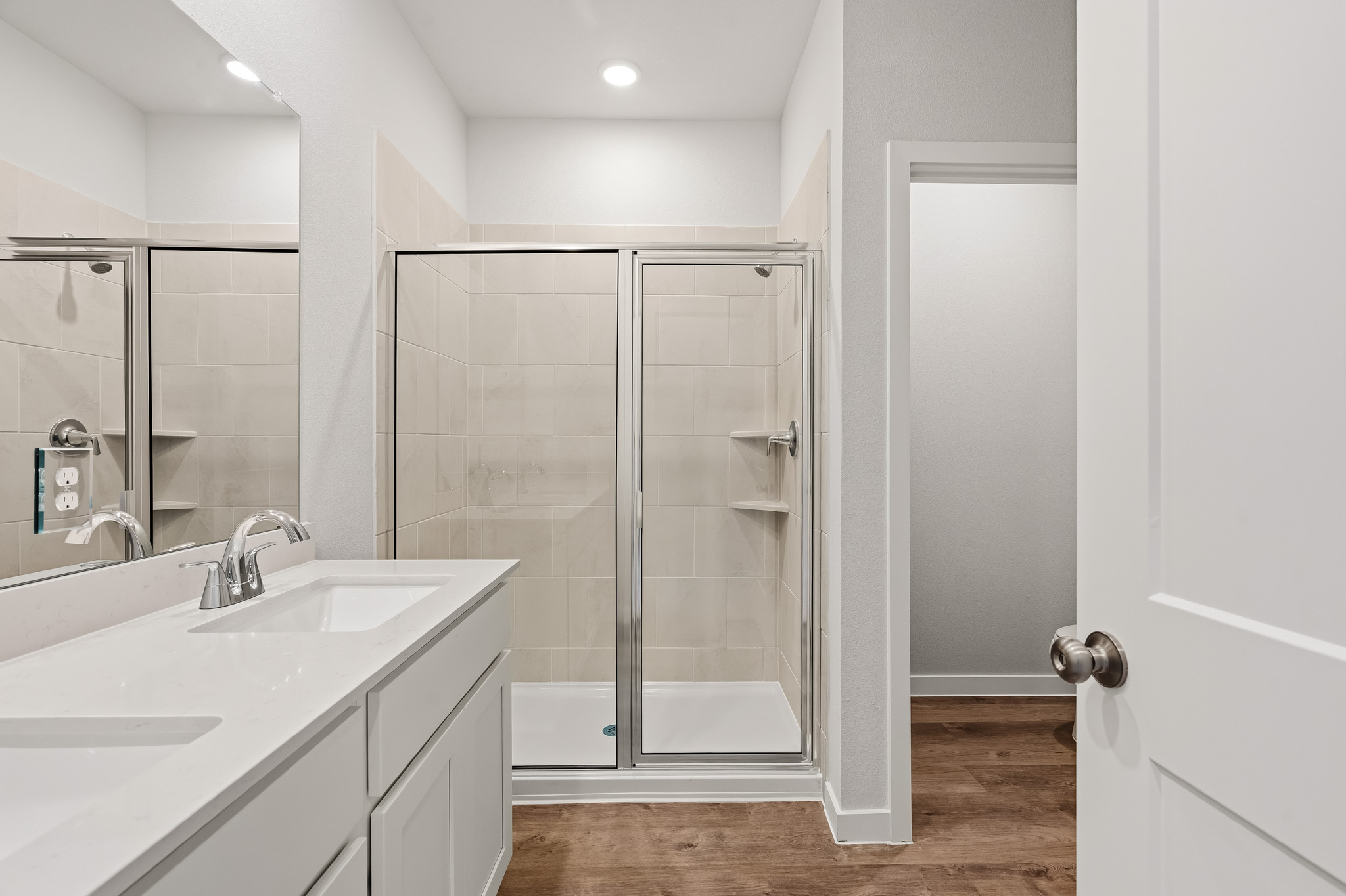 A bathroom with a glass shower.