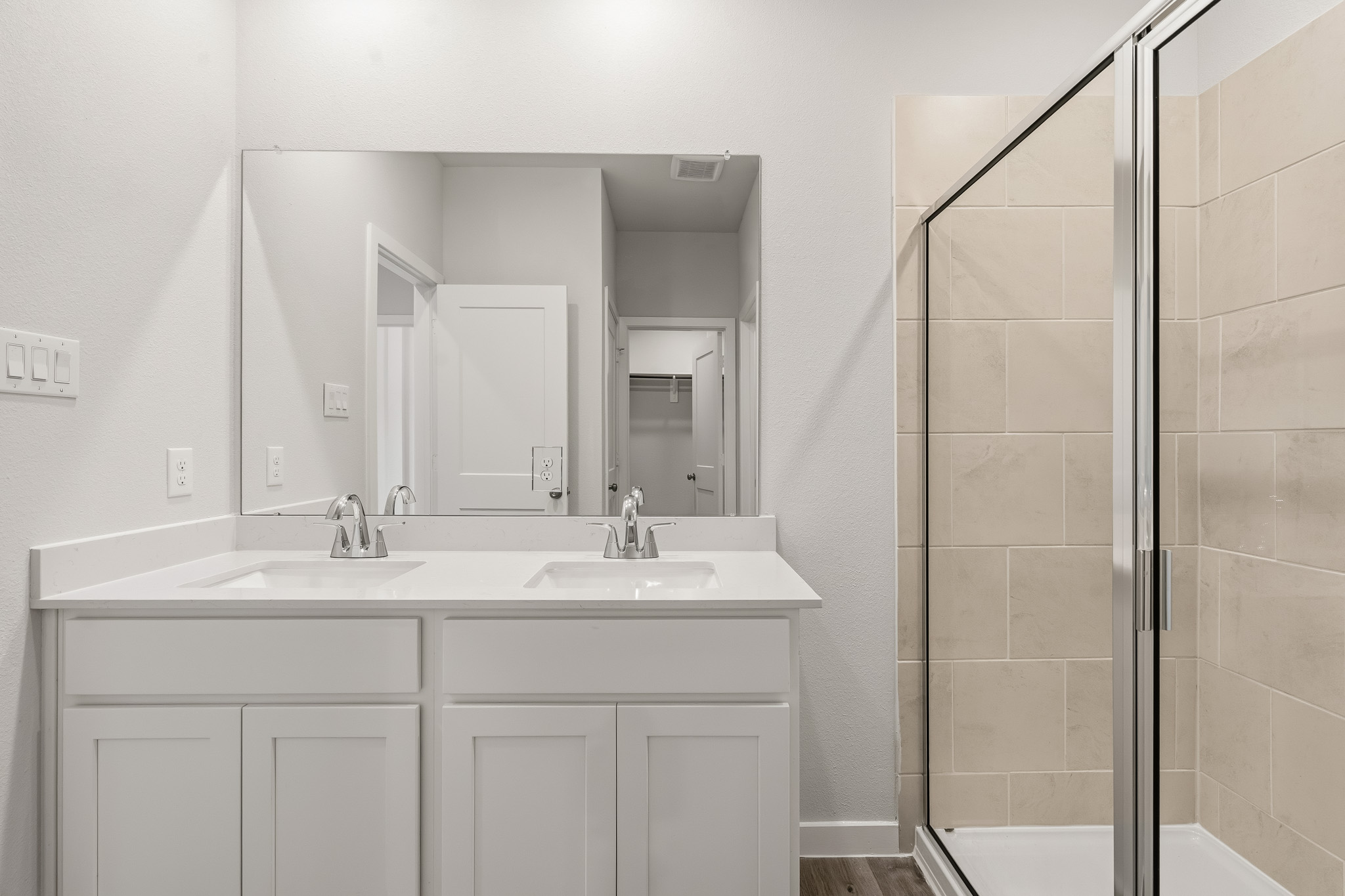 A bathroom with a glass shower.