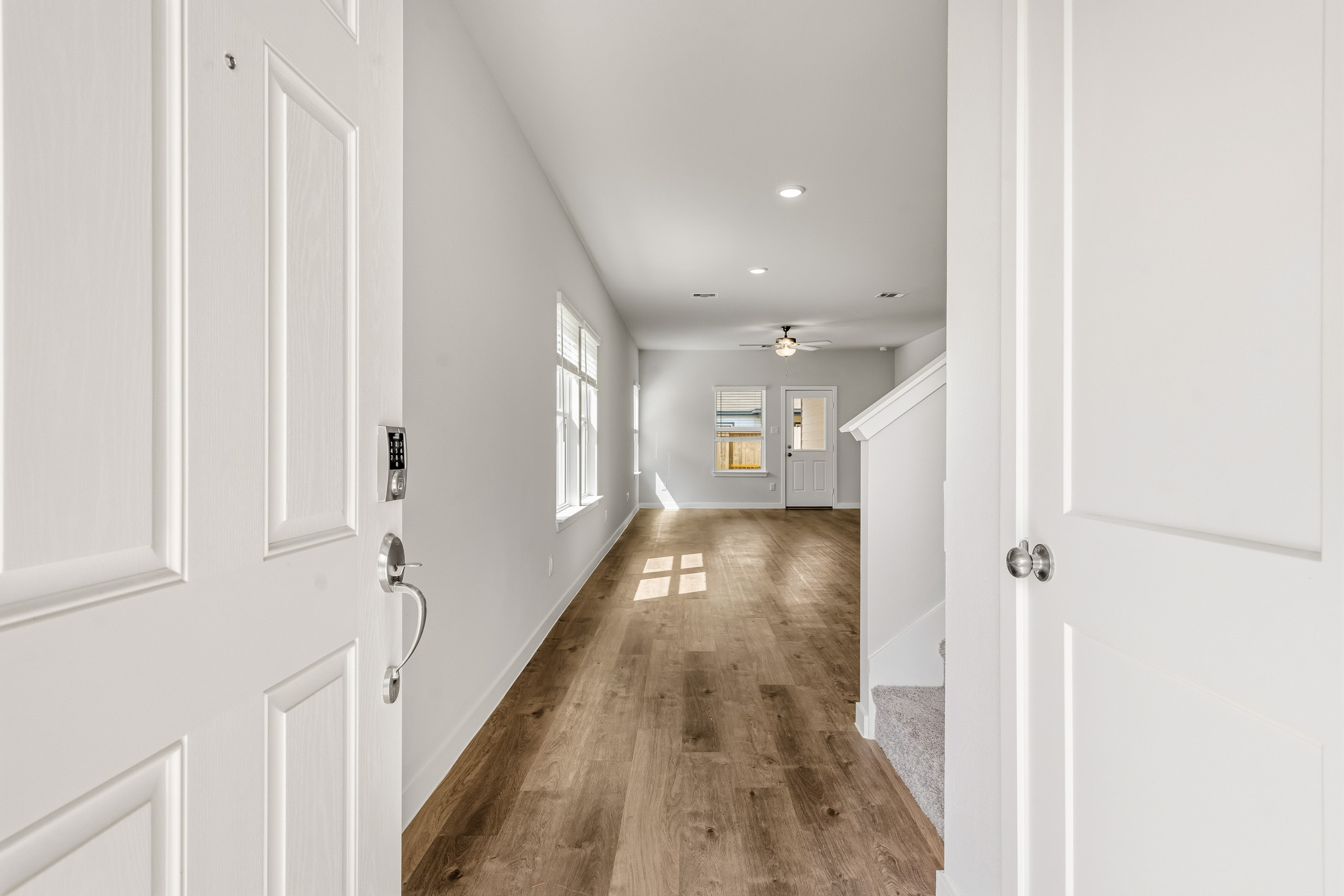 A hallway with white doors.